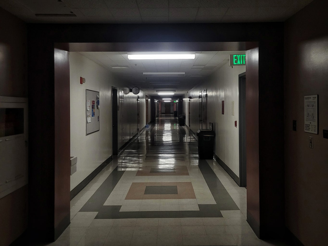dimly lit hallway in building