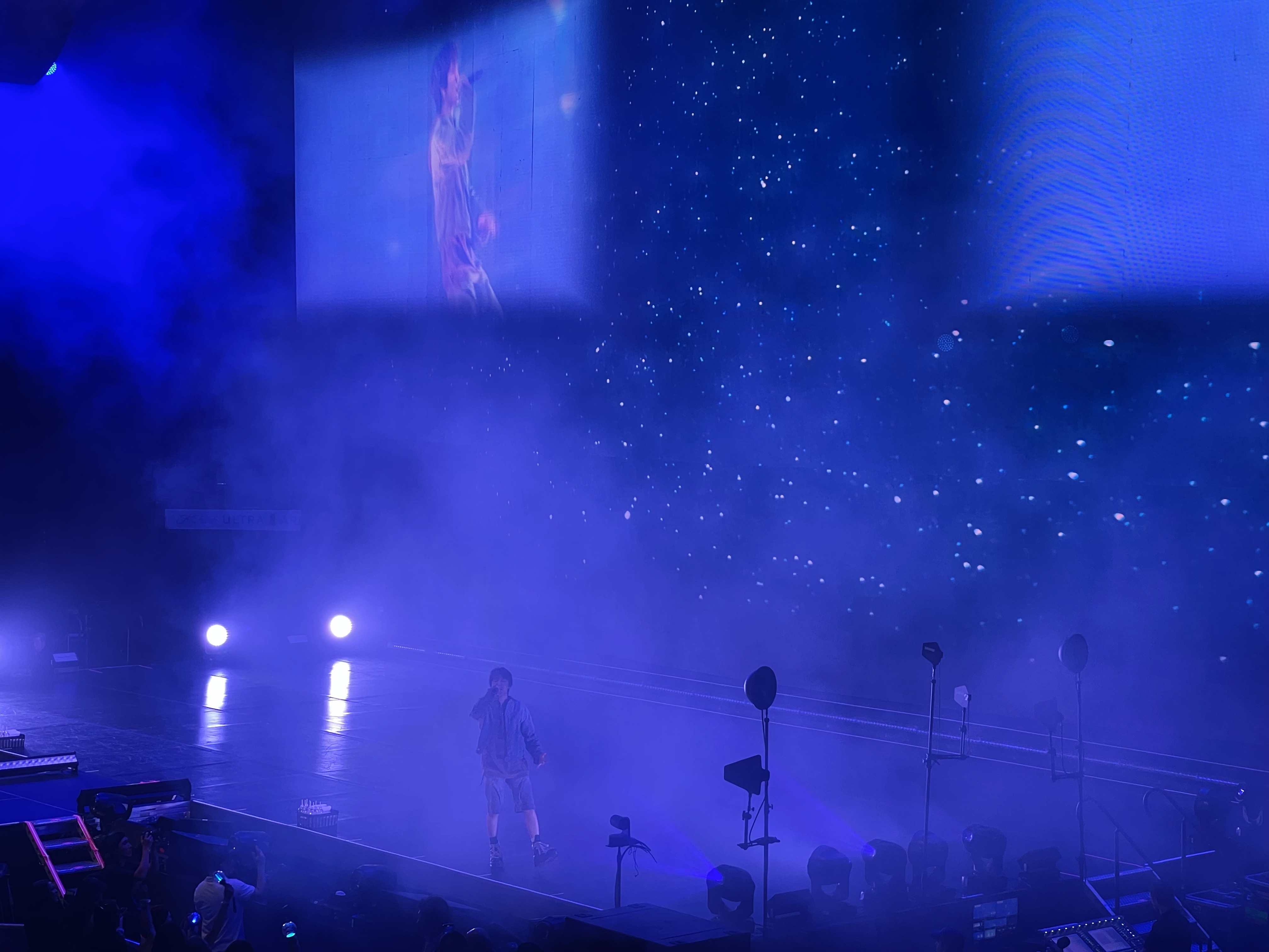 k-pop singer singing on stage