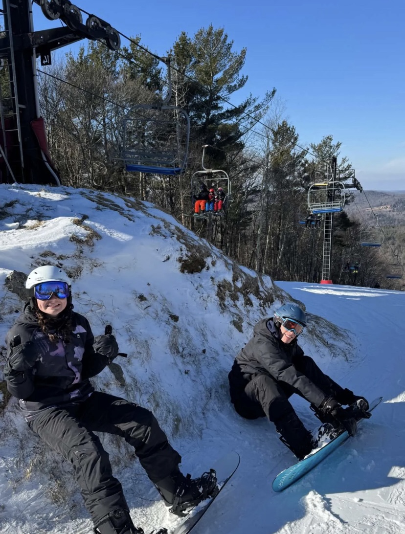 Siblings snowboarding