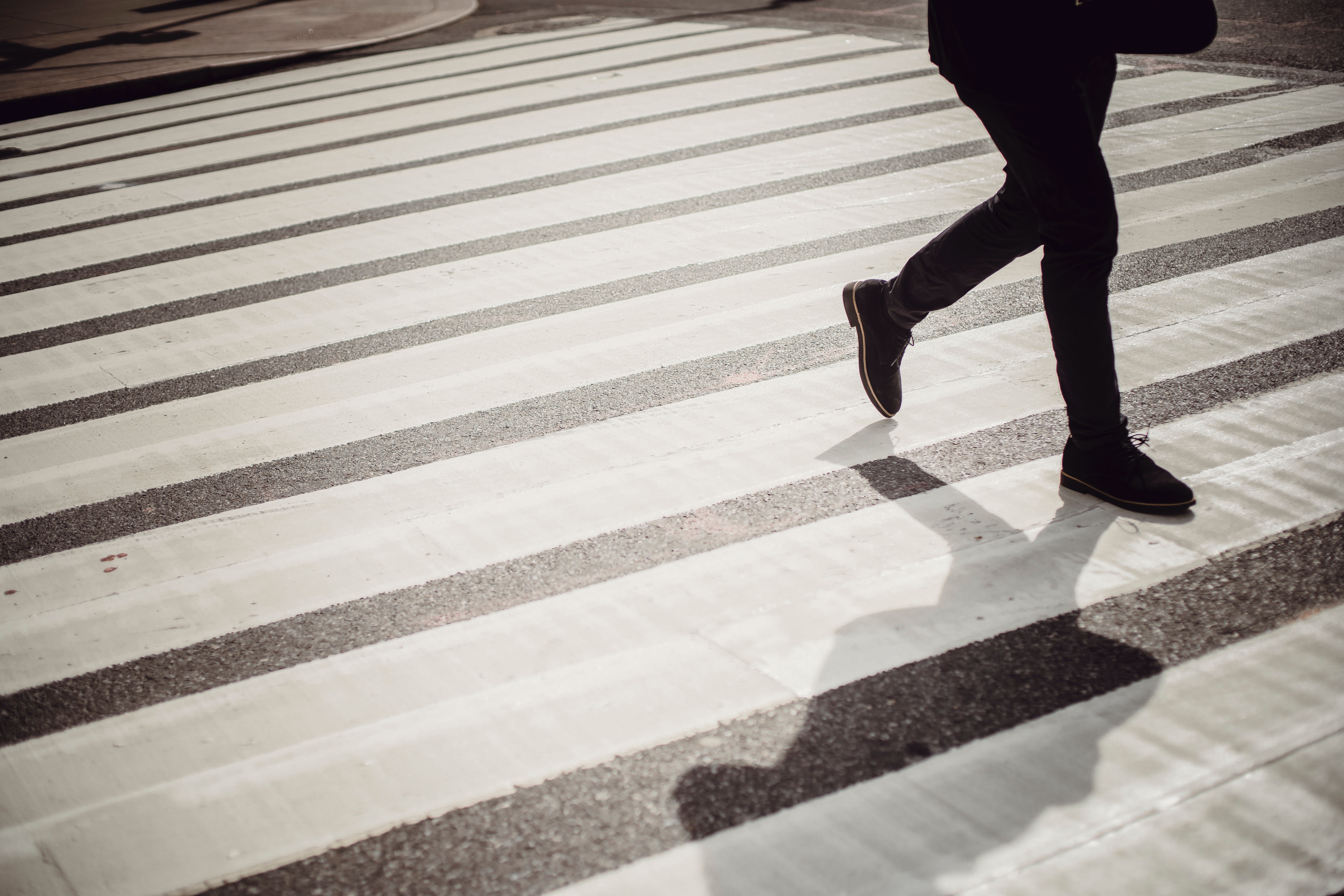 person crossing a crosswalk
