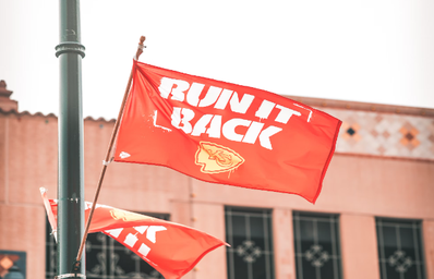 chiefs flag that reads \"run it back\"