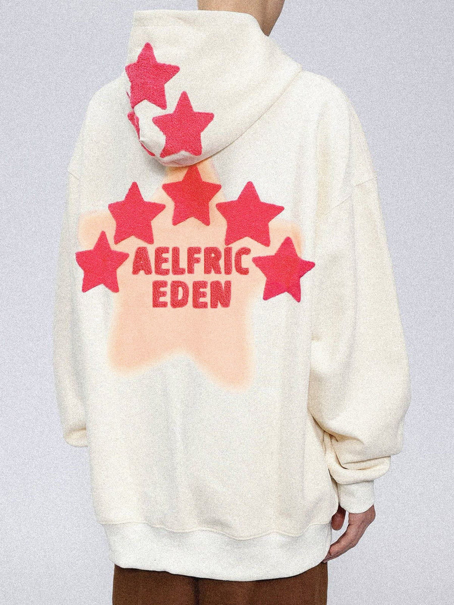 a hoodie with a pink star on it