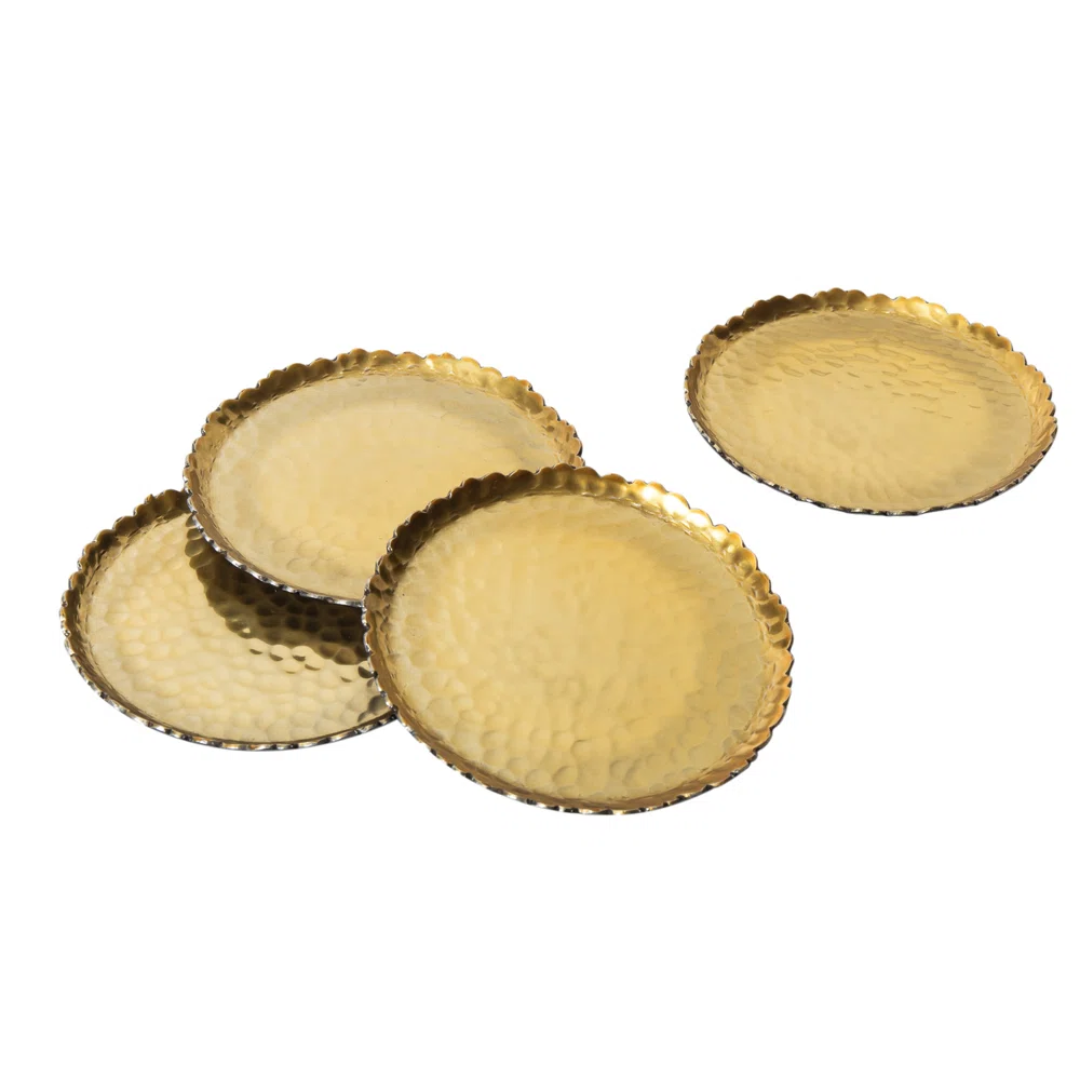 set of four gold metal coasters