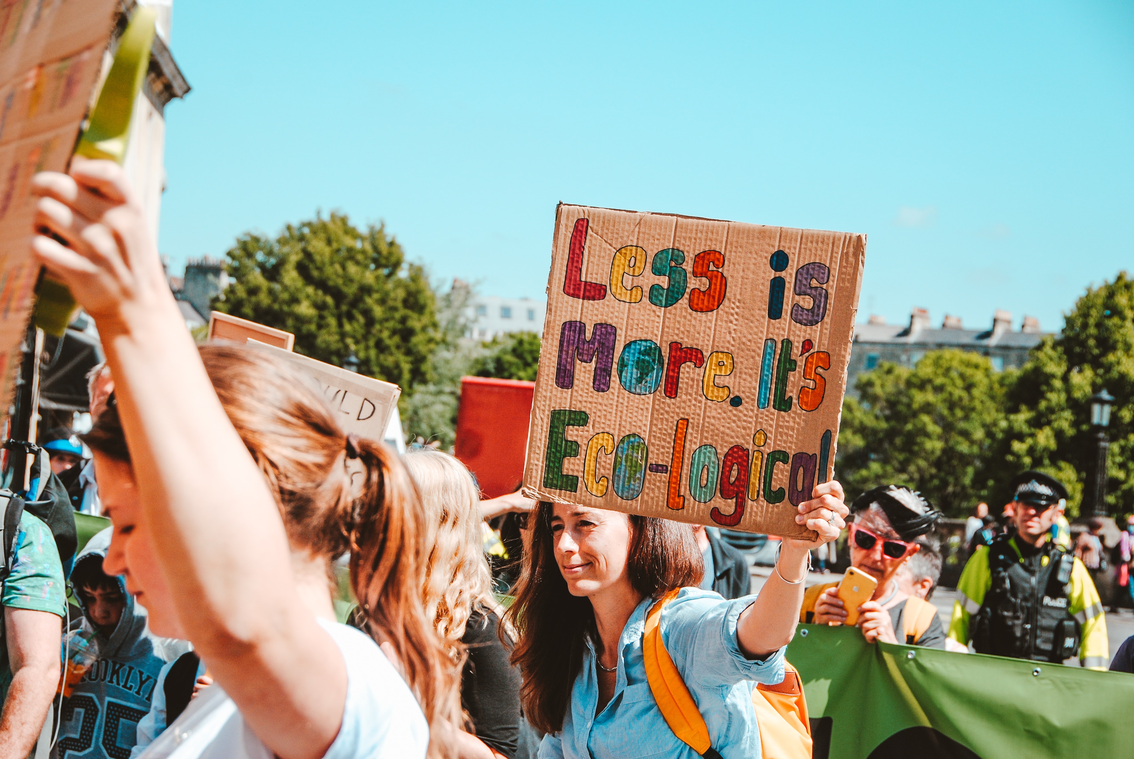 people holding up signs in protest