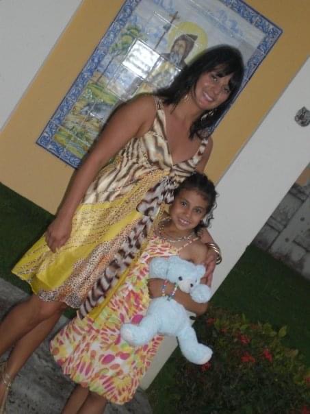 young girl with mother and teddy bear