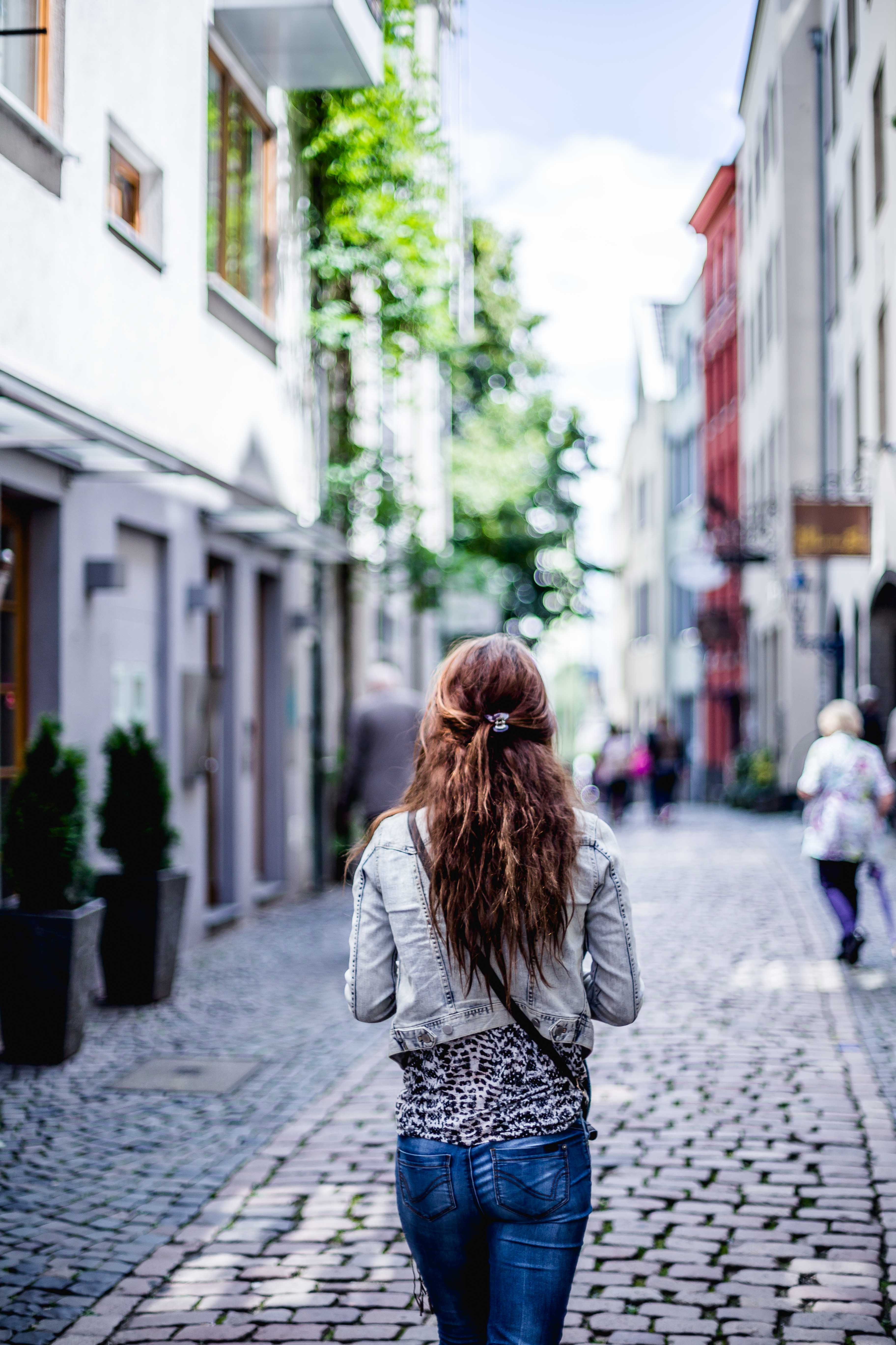 A girl walking down a street