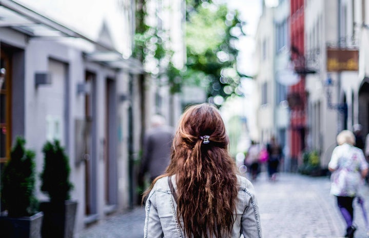 A girl walking down a street
