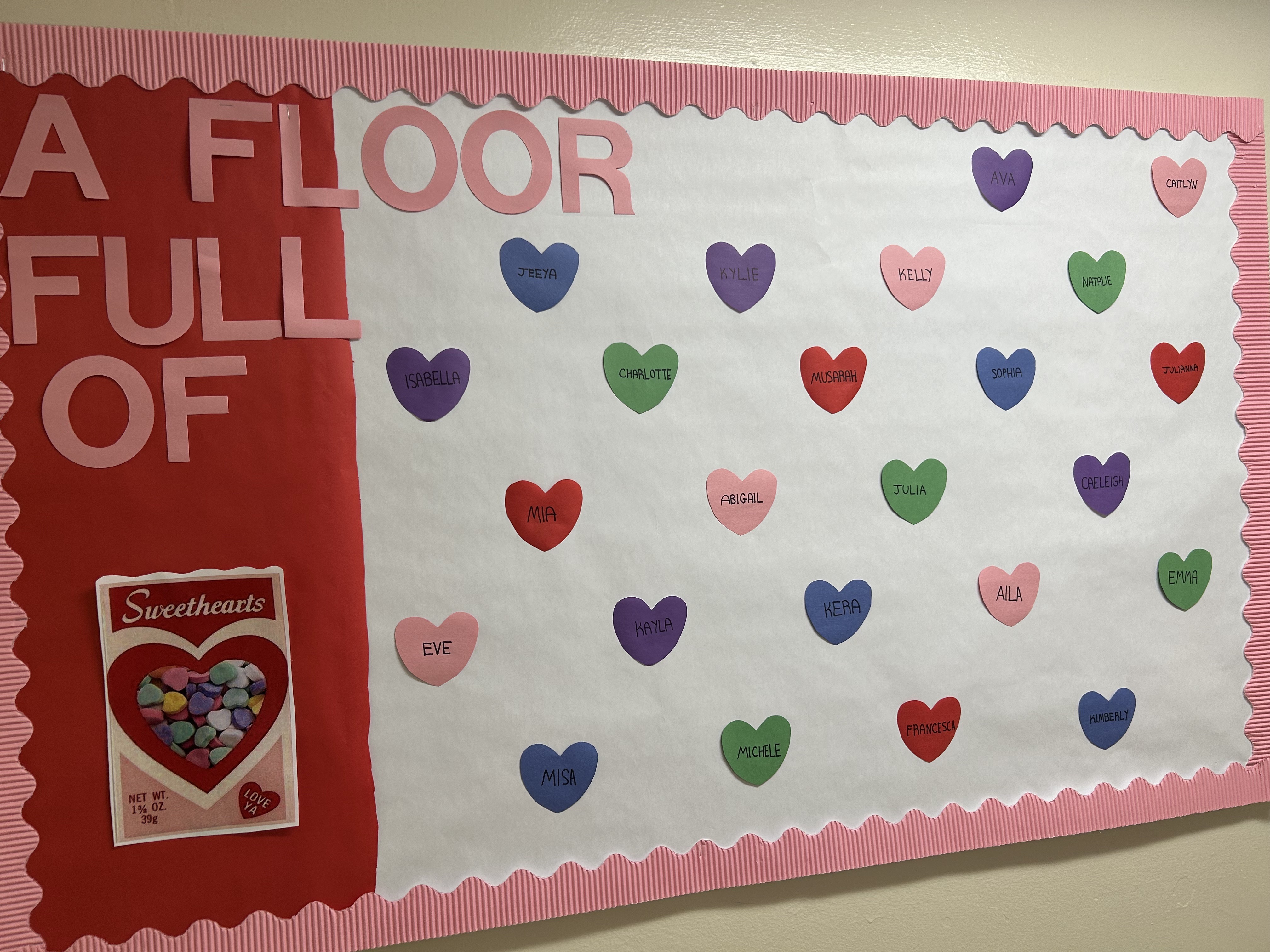 Residents of my floor board, their first names only on hearts and board is decorated by me