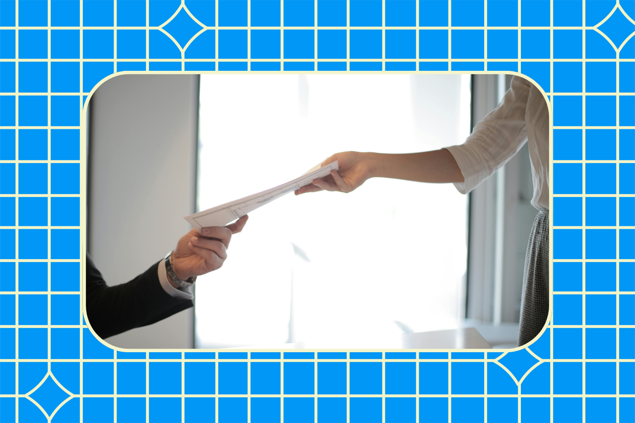 Woman handing man job application