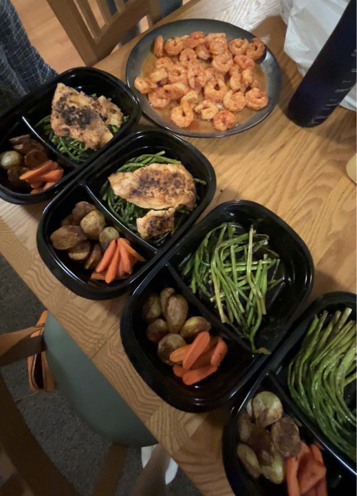 Salmon, green beans, and other veggies in four portions