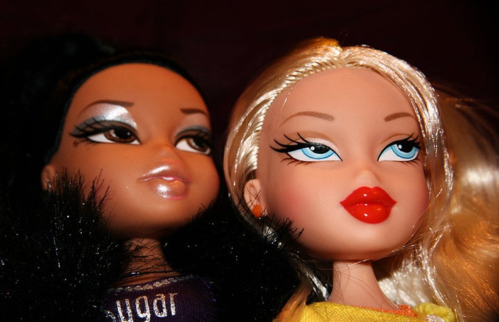 Two Bratz dolls faces; Sasha and Cole