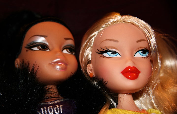 Two Bratz dolls faces; Sasha and Cole