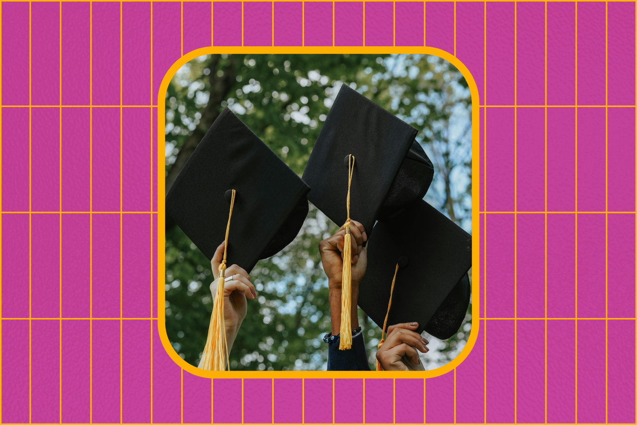 students holding graduation caps