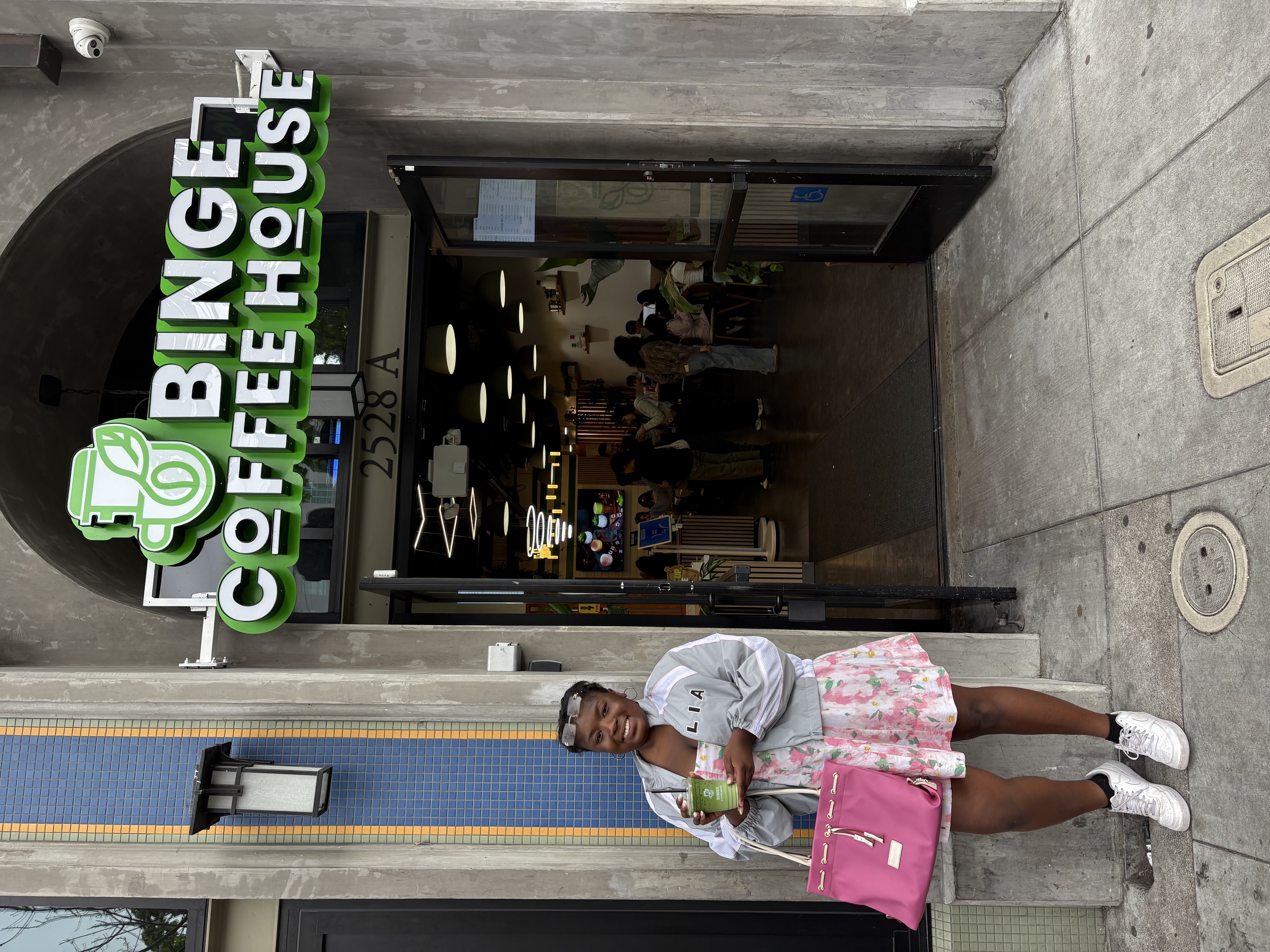 Photo of author in front of a matcha place at Berkeley.