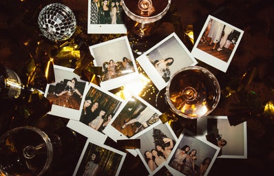 Polaroids from a party on a table.