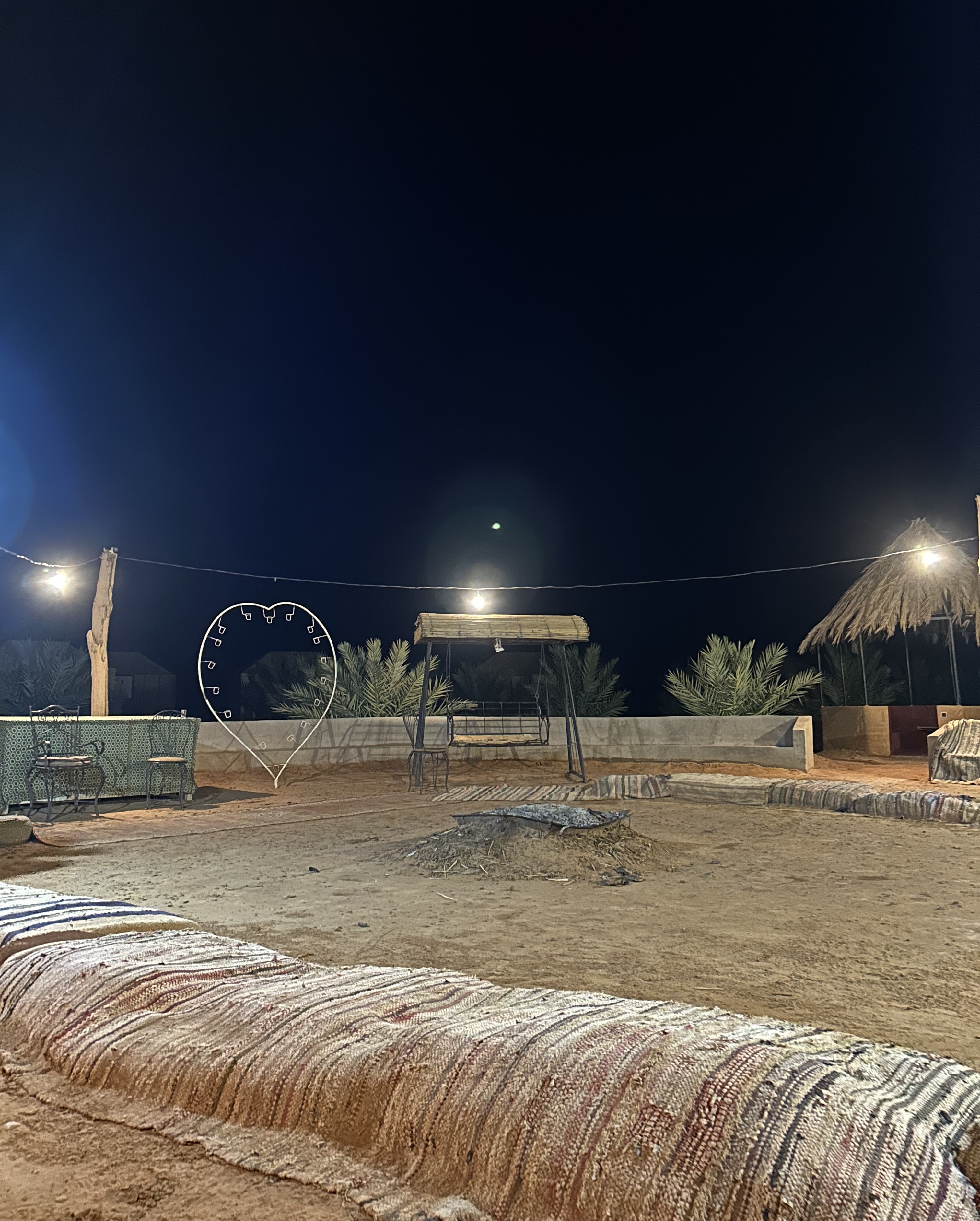 A campsite at night in the Sahara Desert in Morocco.