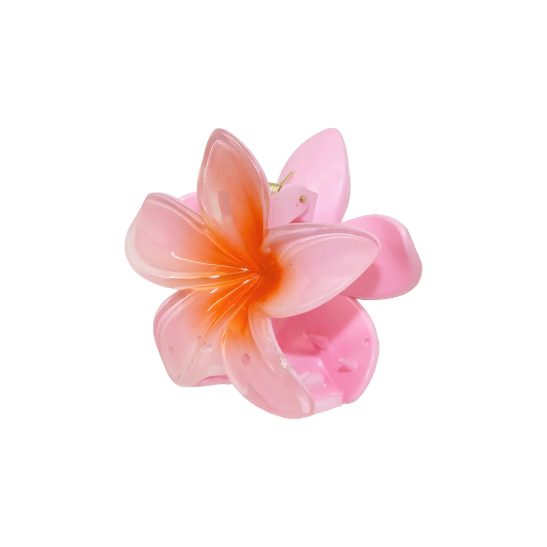 A pink and orange flower-shaped hair clip with soft, translucent petals. The vibrant design adds a cheerful and playful touch.