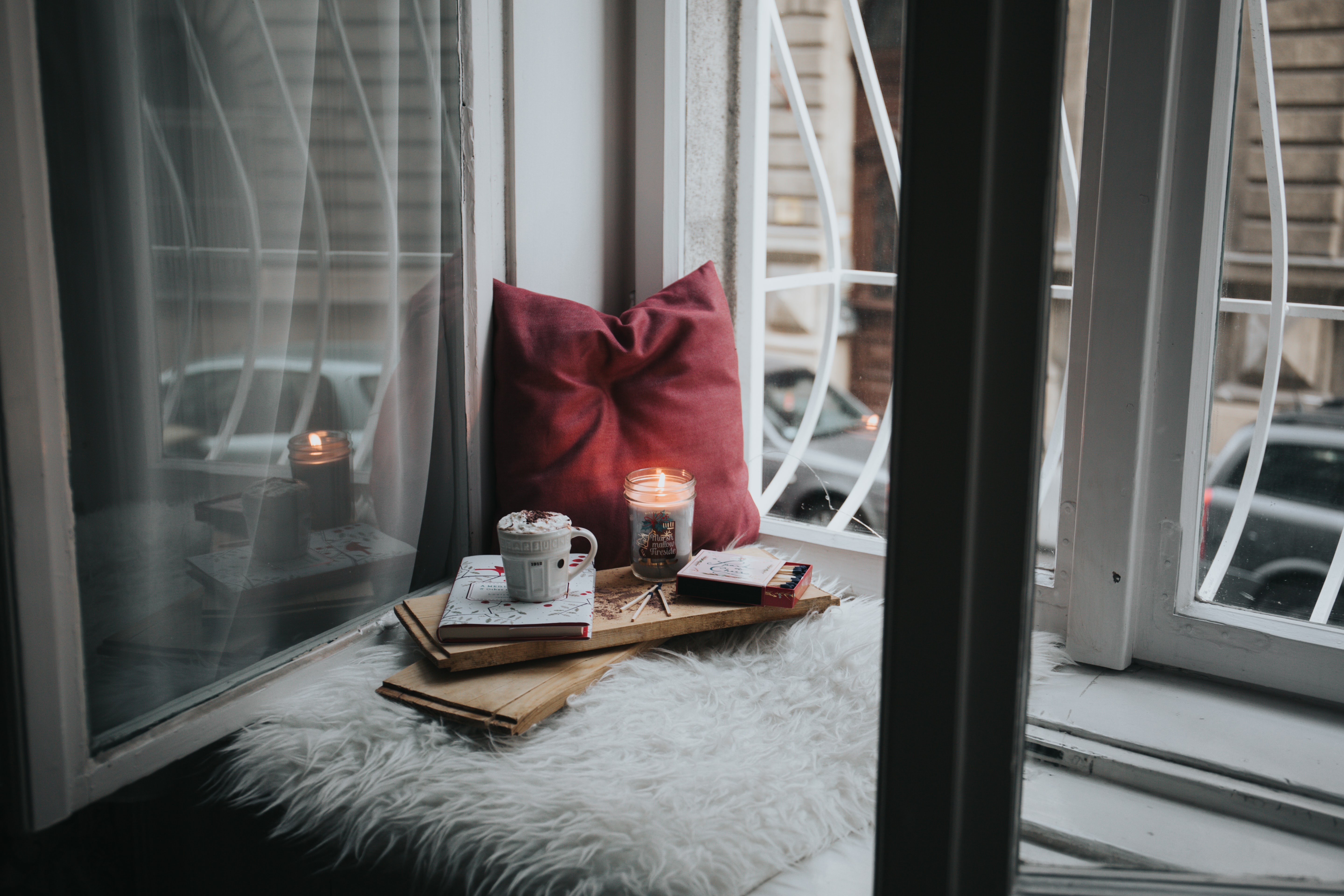 A room with books and a candle