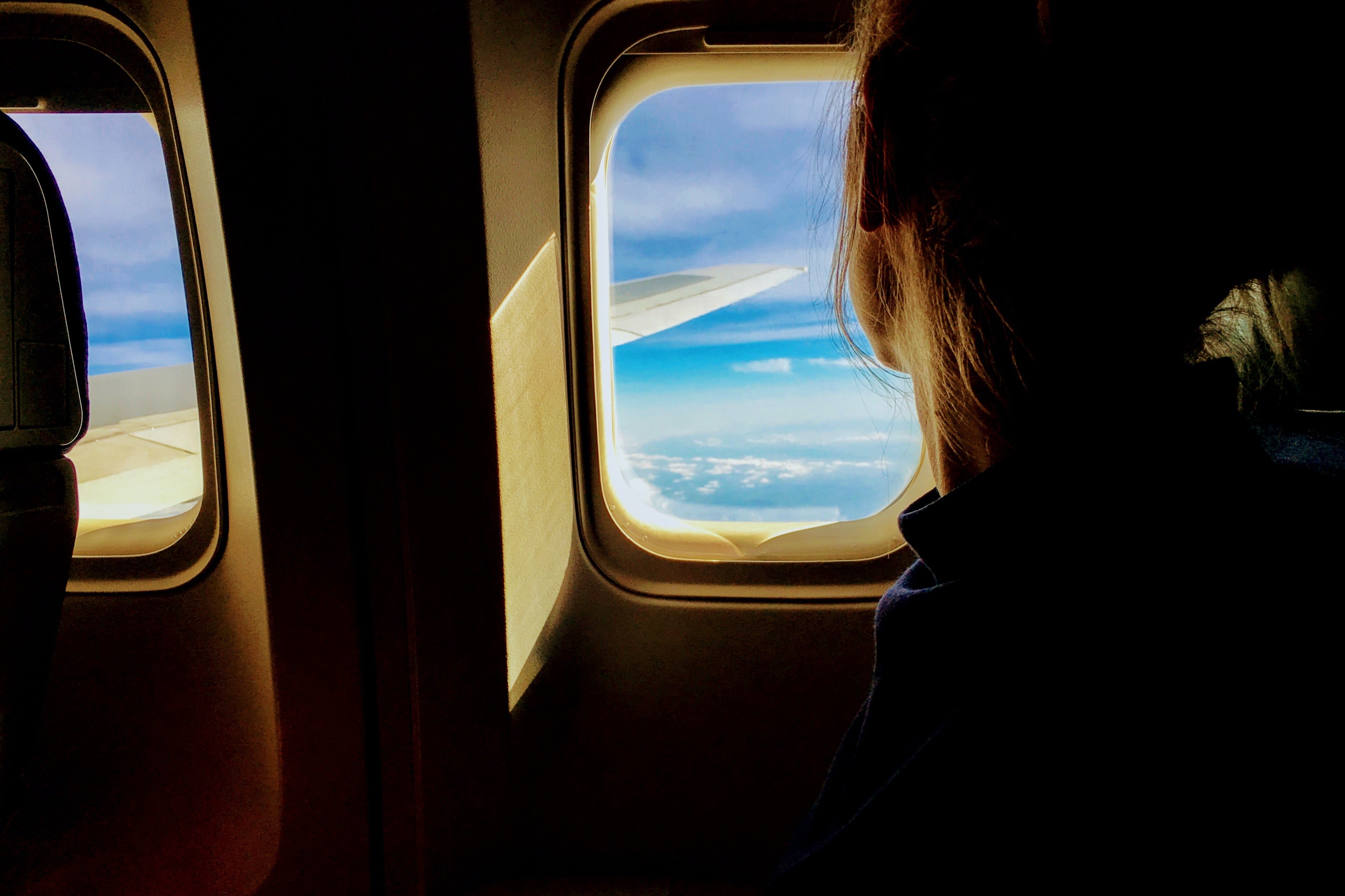 Person looking outside of an airplane