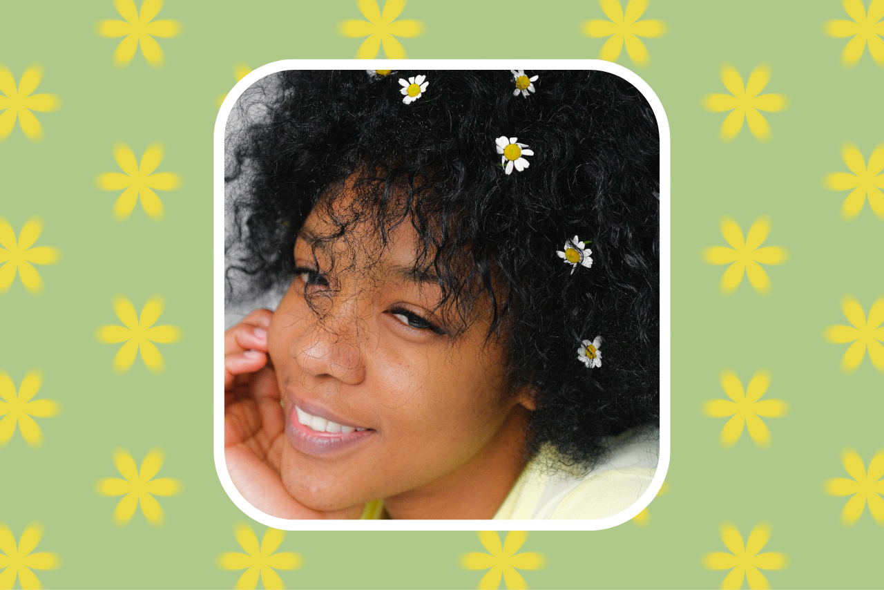 smiling woman with flowers in her hair