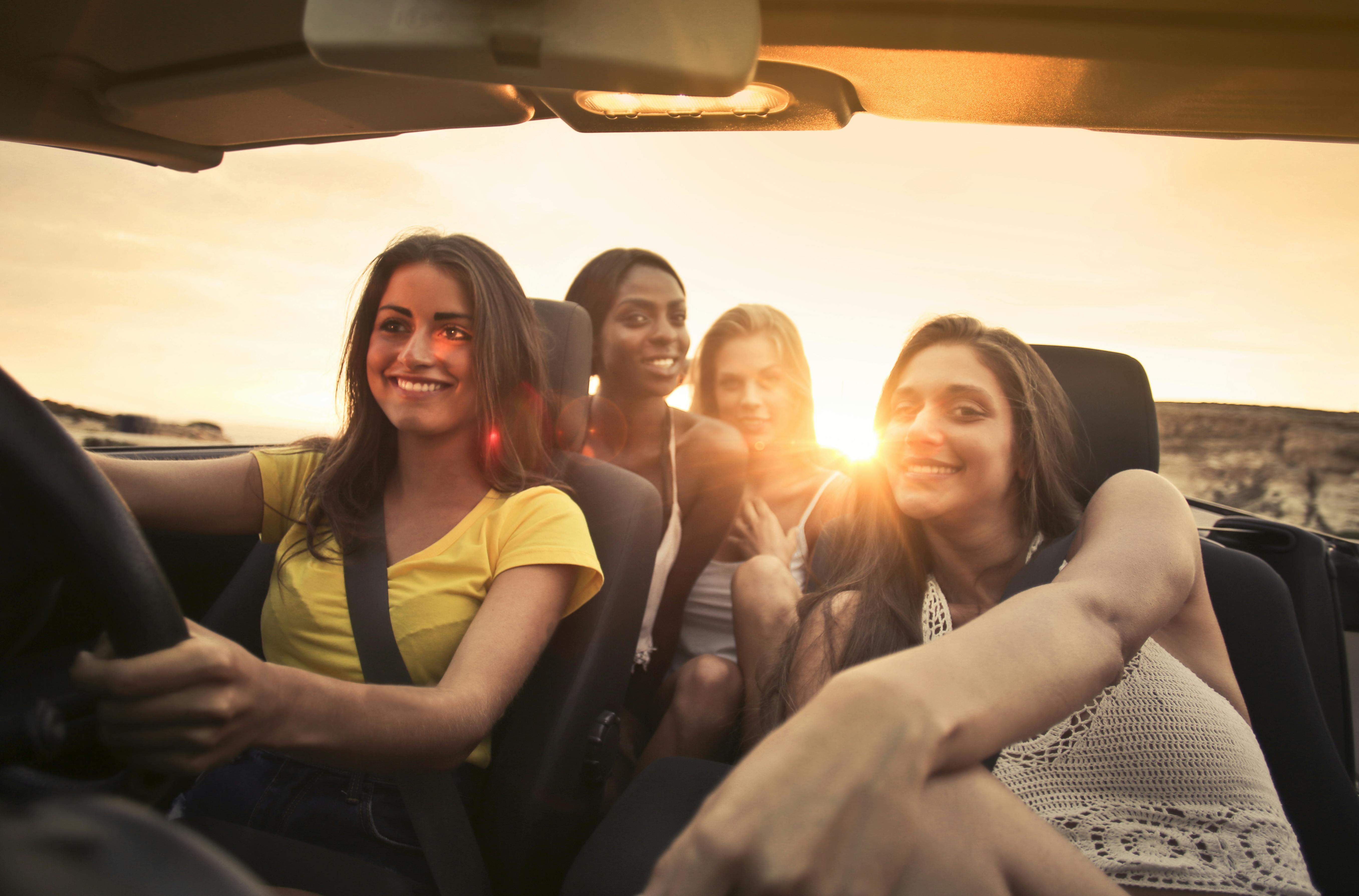 Multicultural friend group in convertible