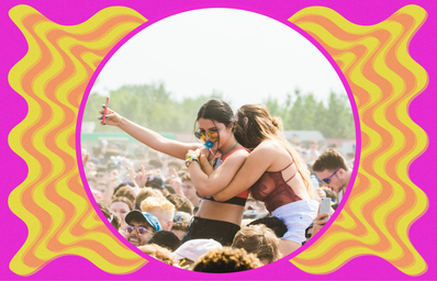 two girls taking a selfie at a music festival