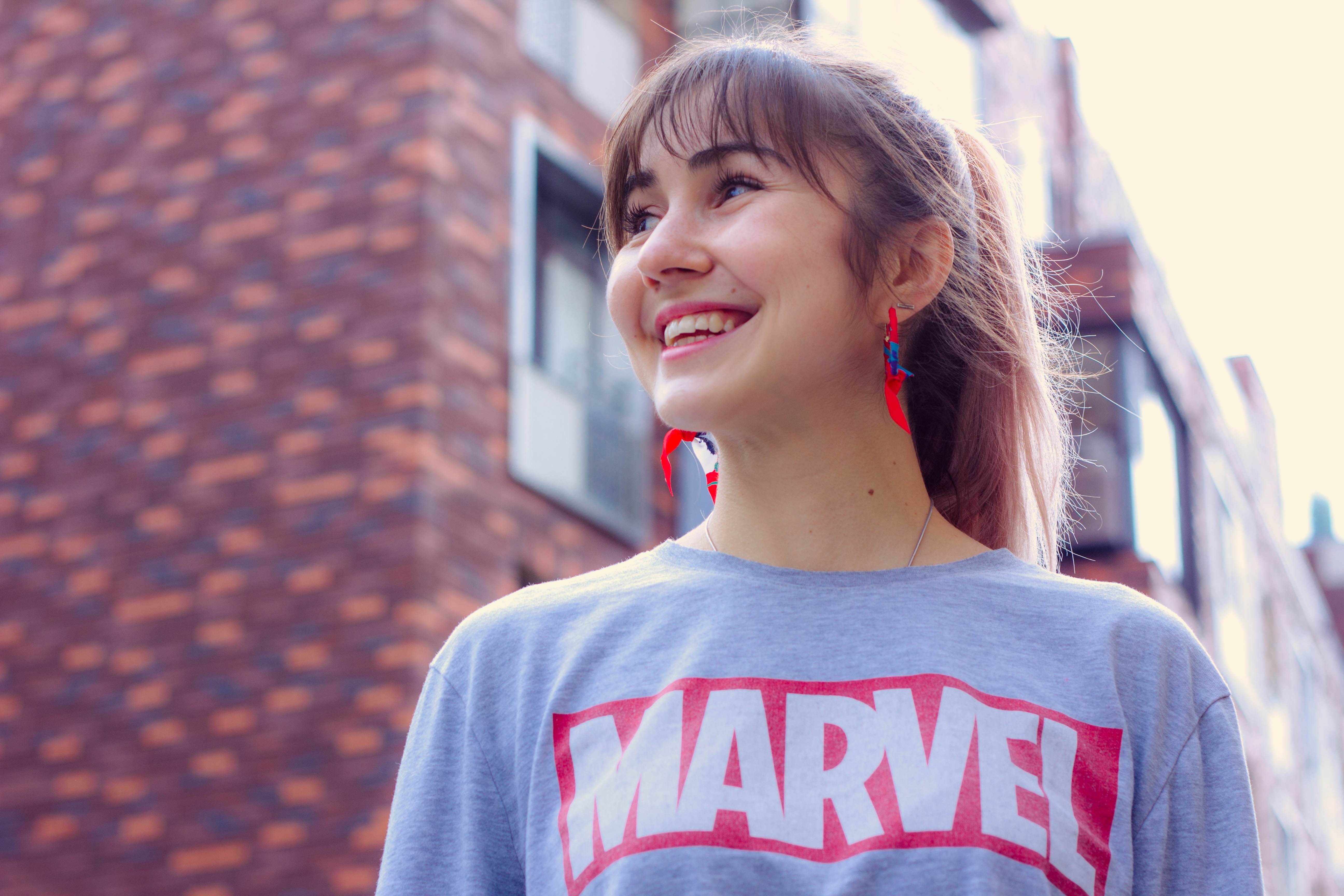 woman wearing marvel shirt by Timur Romanov