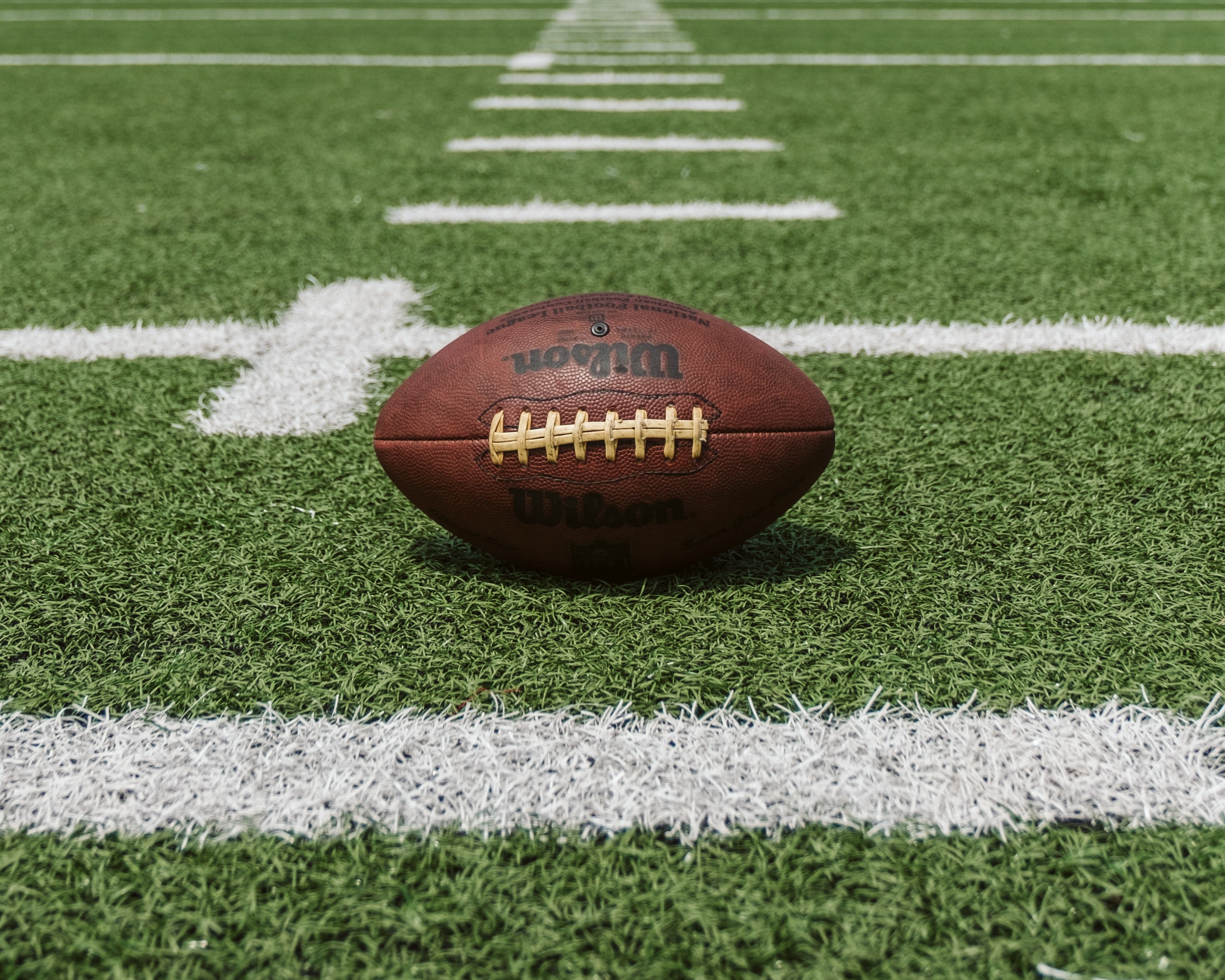 Football on field by Unsplash?width=698&height=466&fit=crop&auto=webp&dpr=4