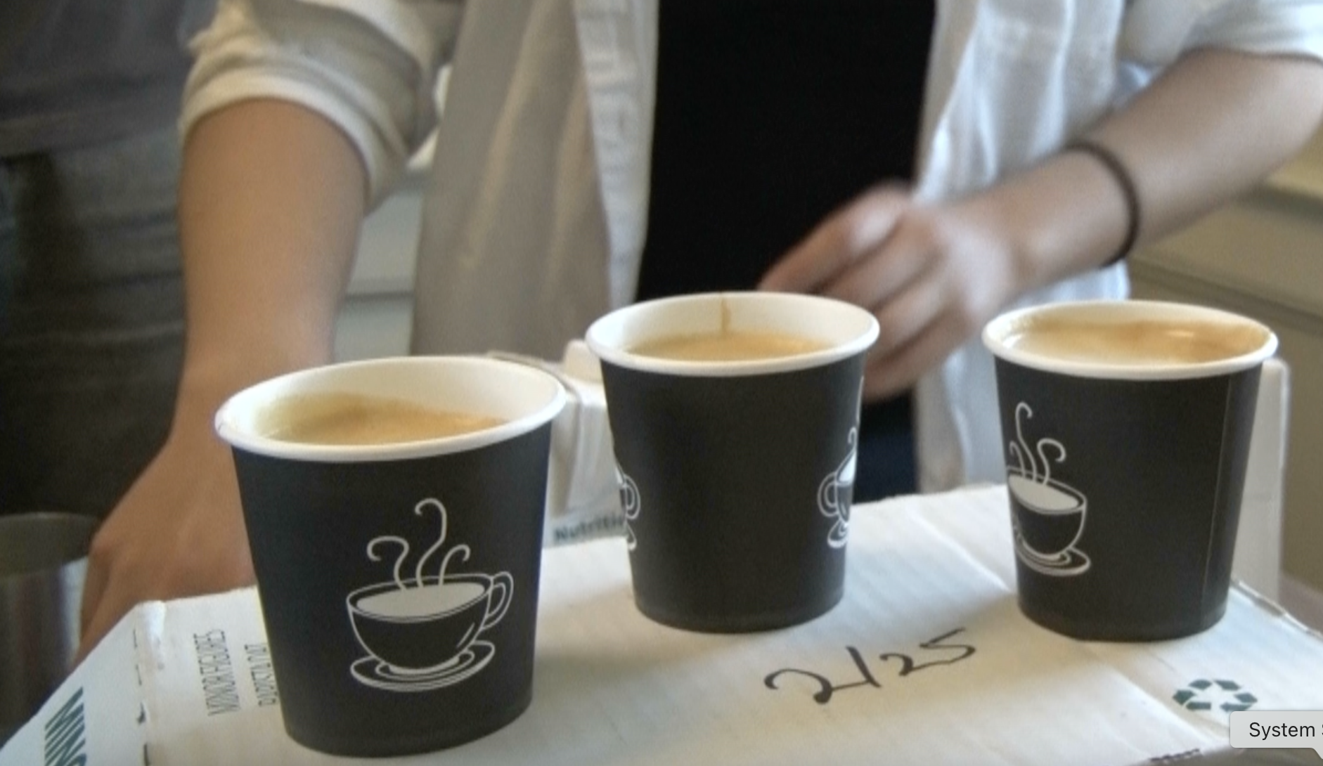 Coffee sample cups being served