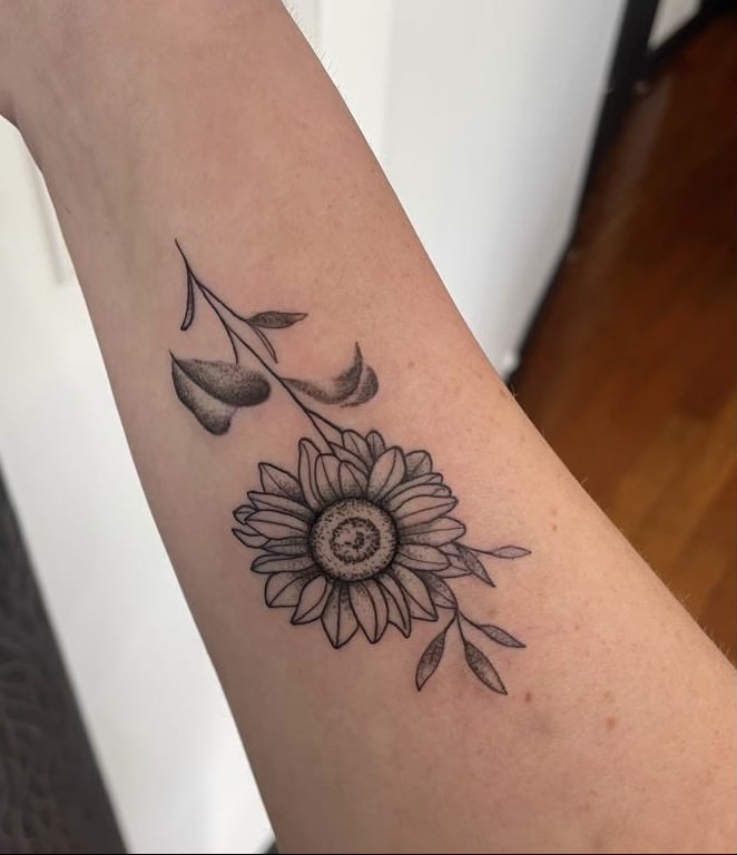 tattoo of a flower on arm