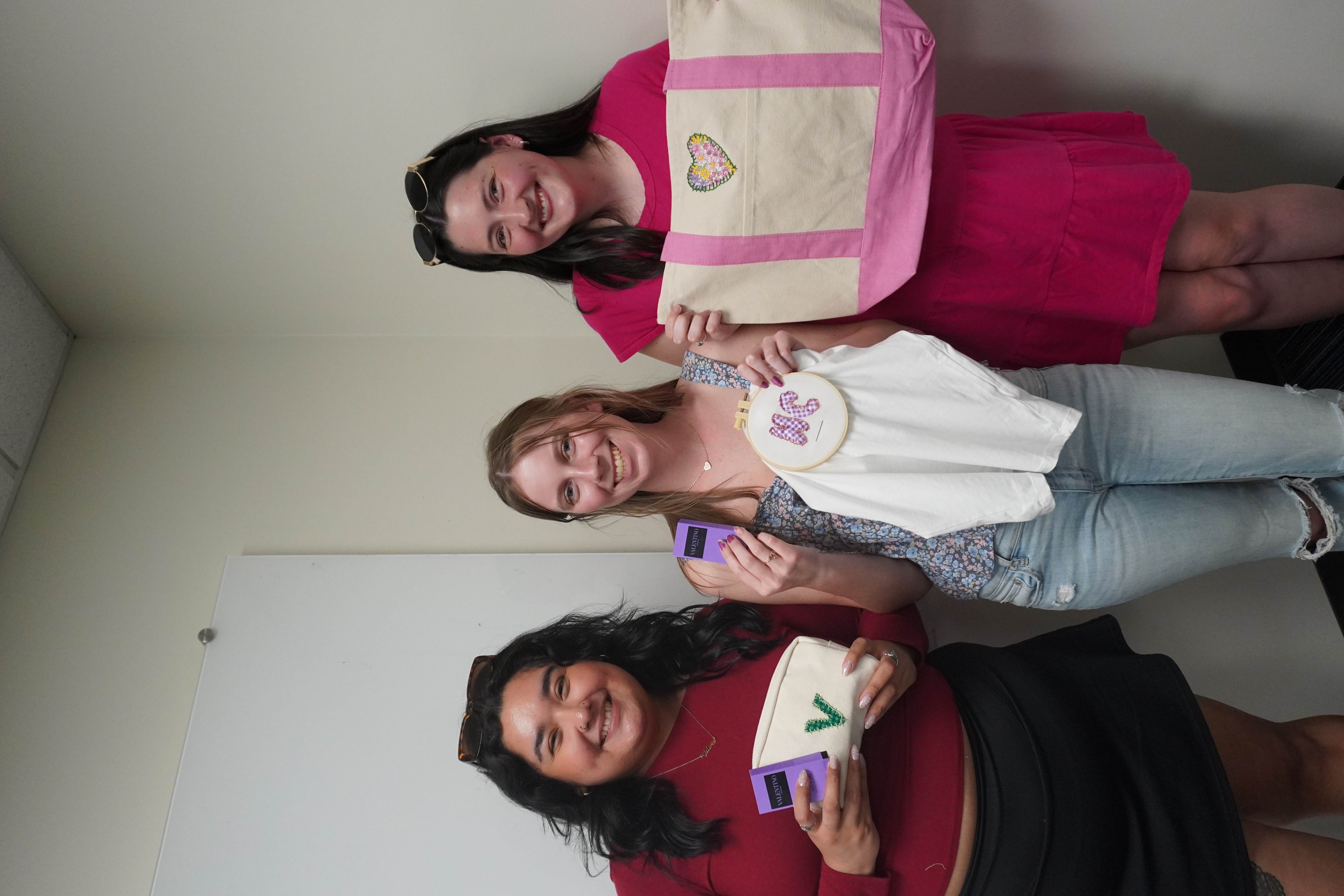 Her Campus ISU members showing off their crafts