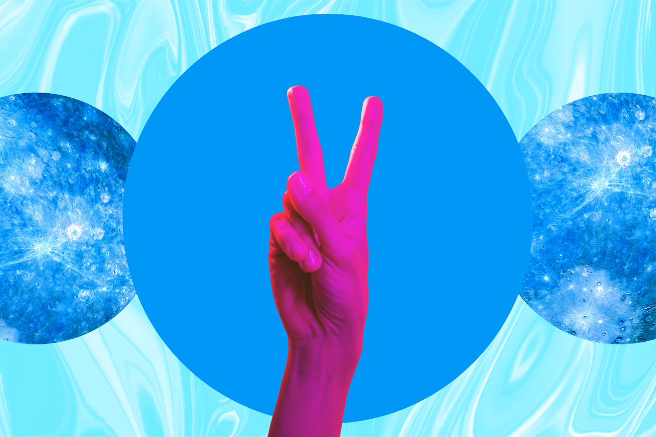 Person holding up peace fingers.