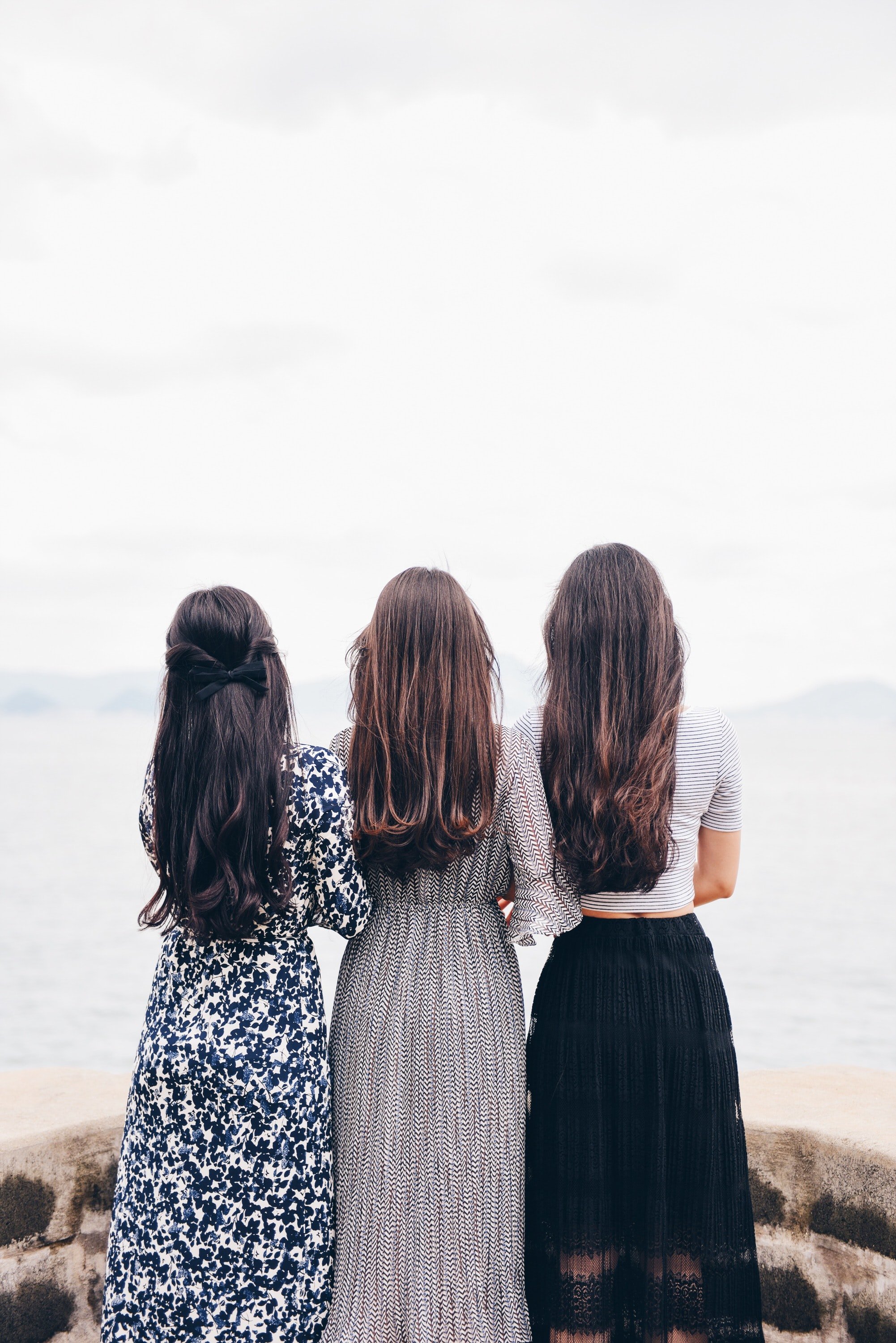 three woman facing water by Suhyeon Choi via Unsplash