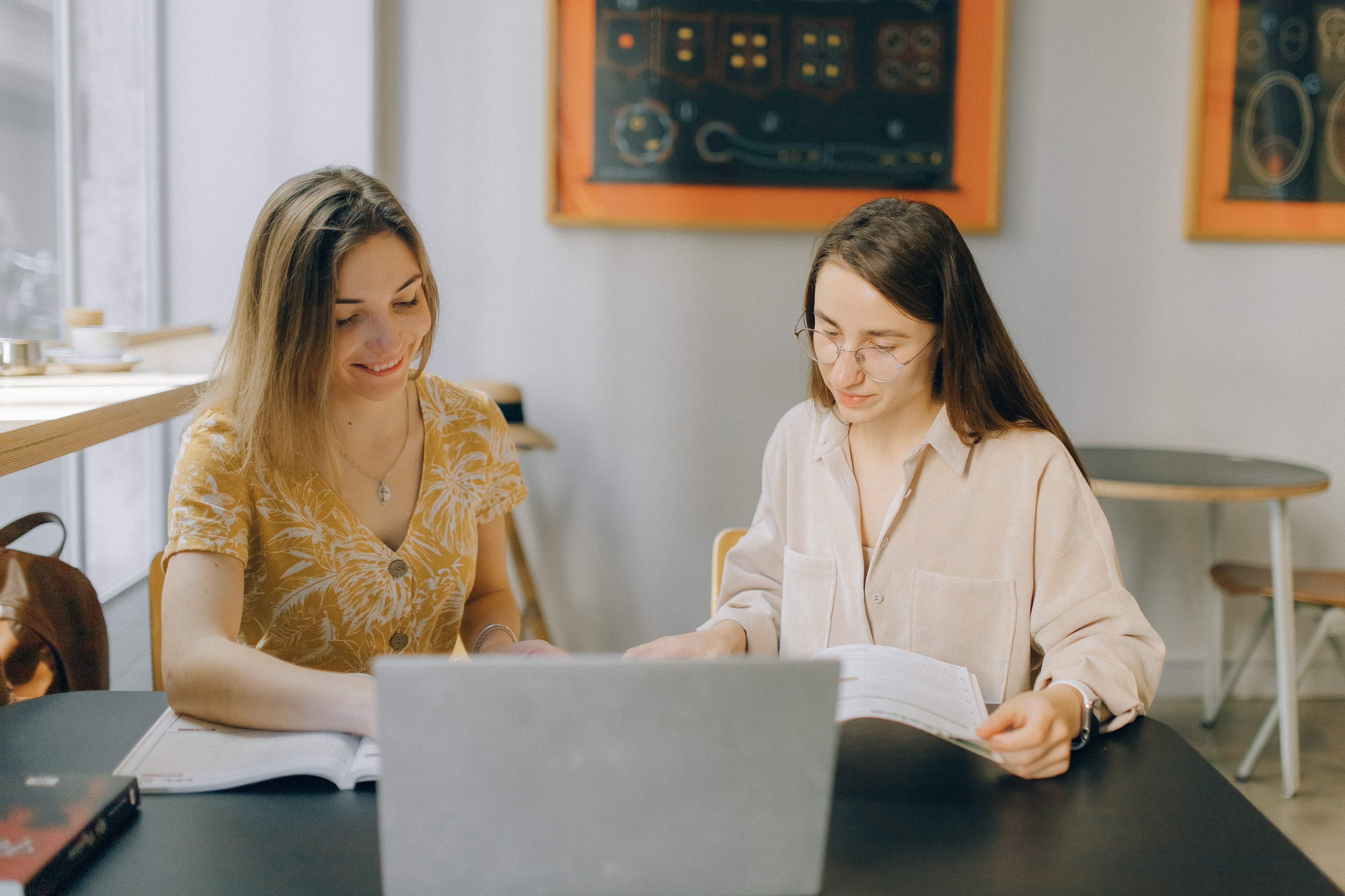 Two women reading together