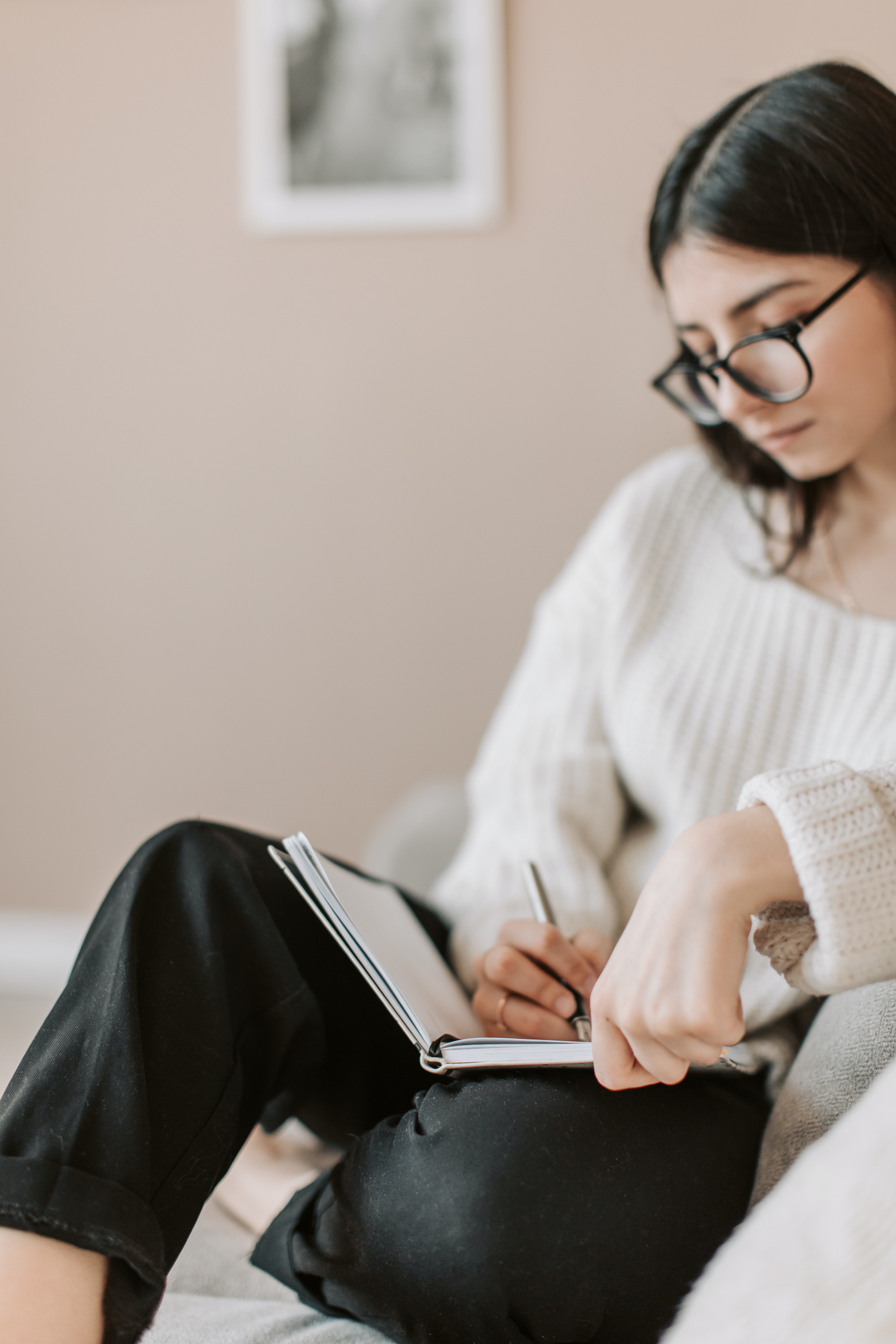 woman writing in notebook