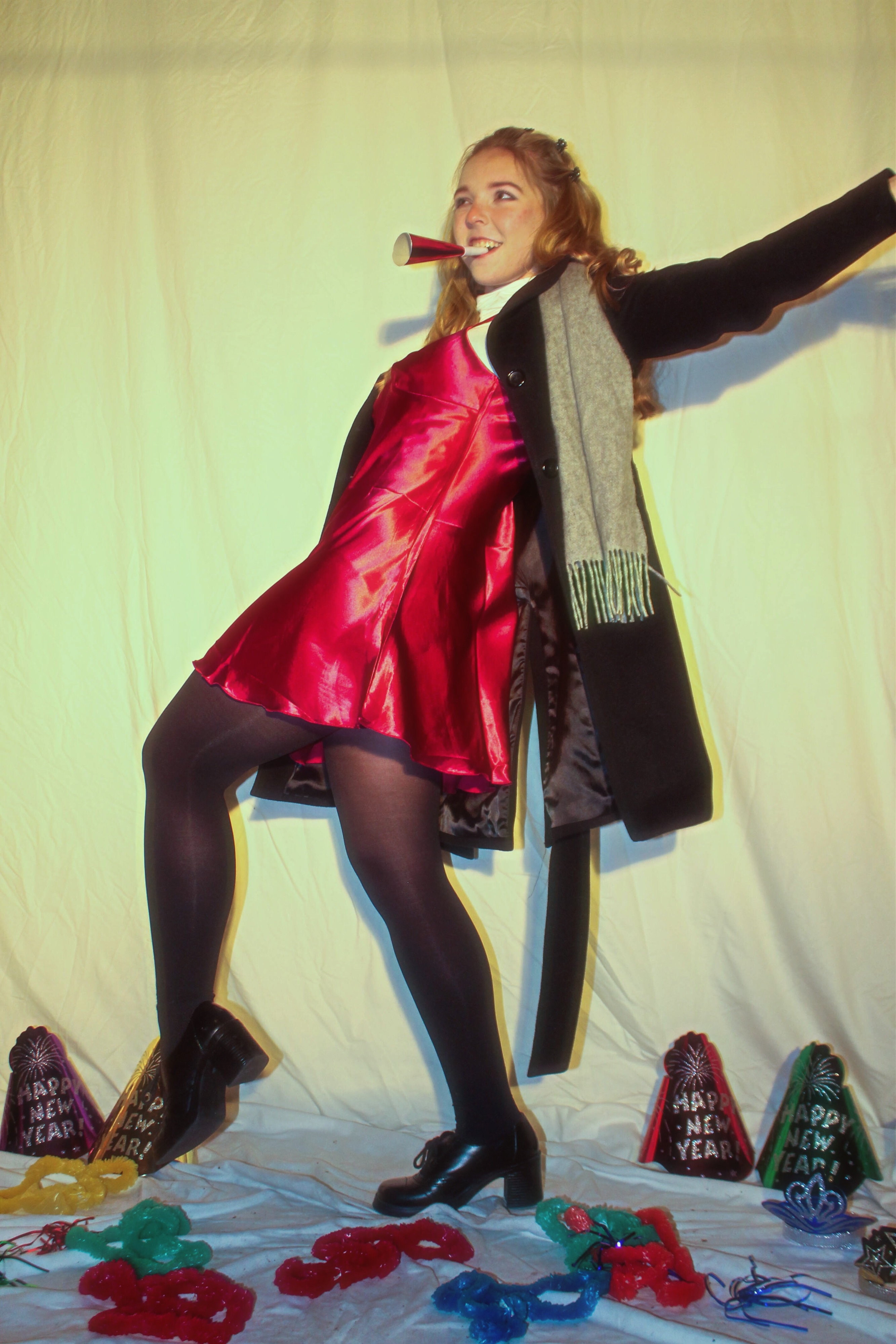 Woman from the 1990s in front of white backdrop