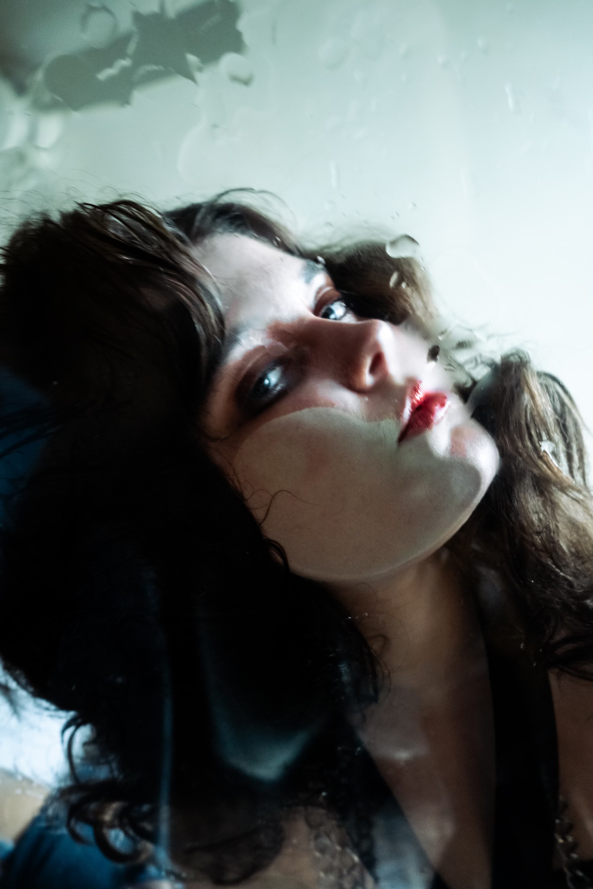 Blurry picture of girl wearing dramatic makeup