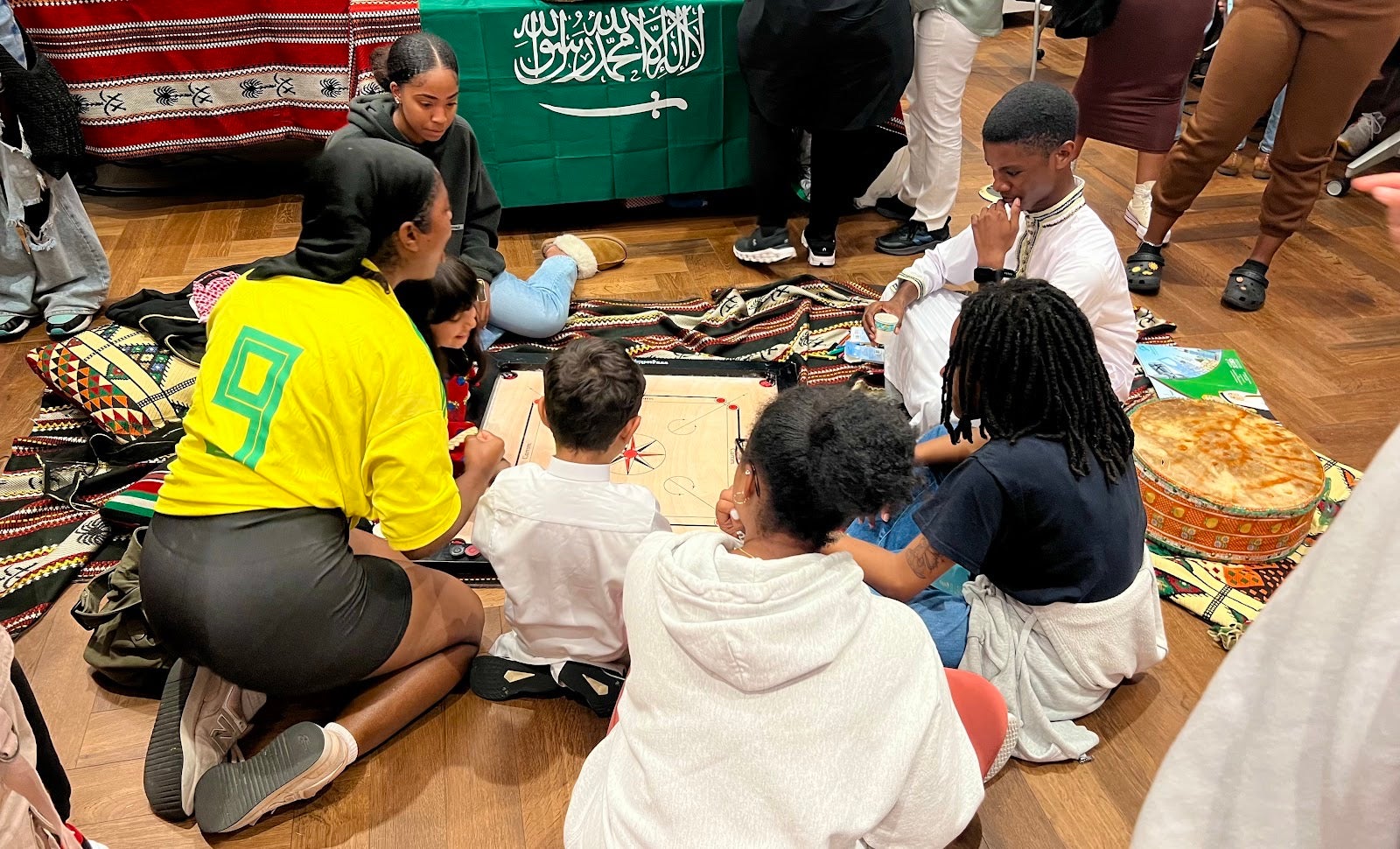 Students play a Saudi Board Game at the festival.