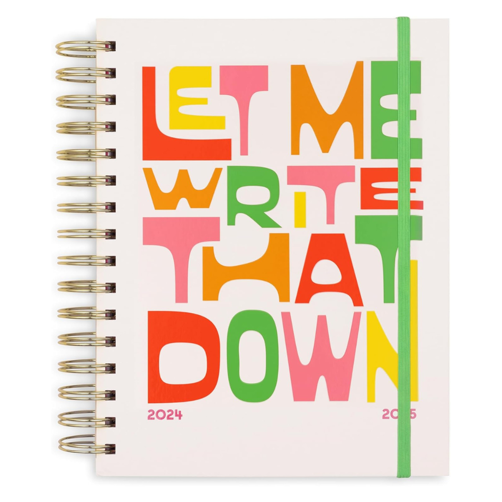 white spiral notebook with multi-colored quote on cover