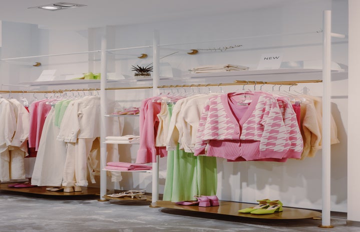 clothes hanging on rack in store