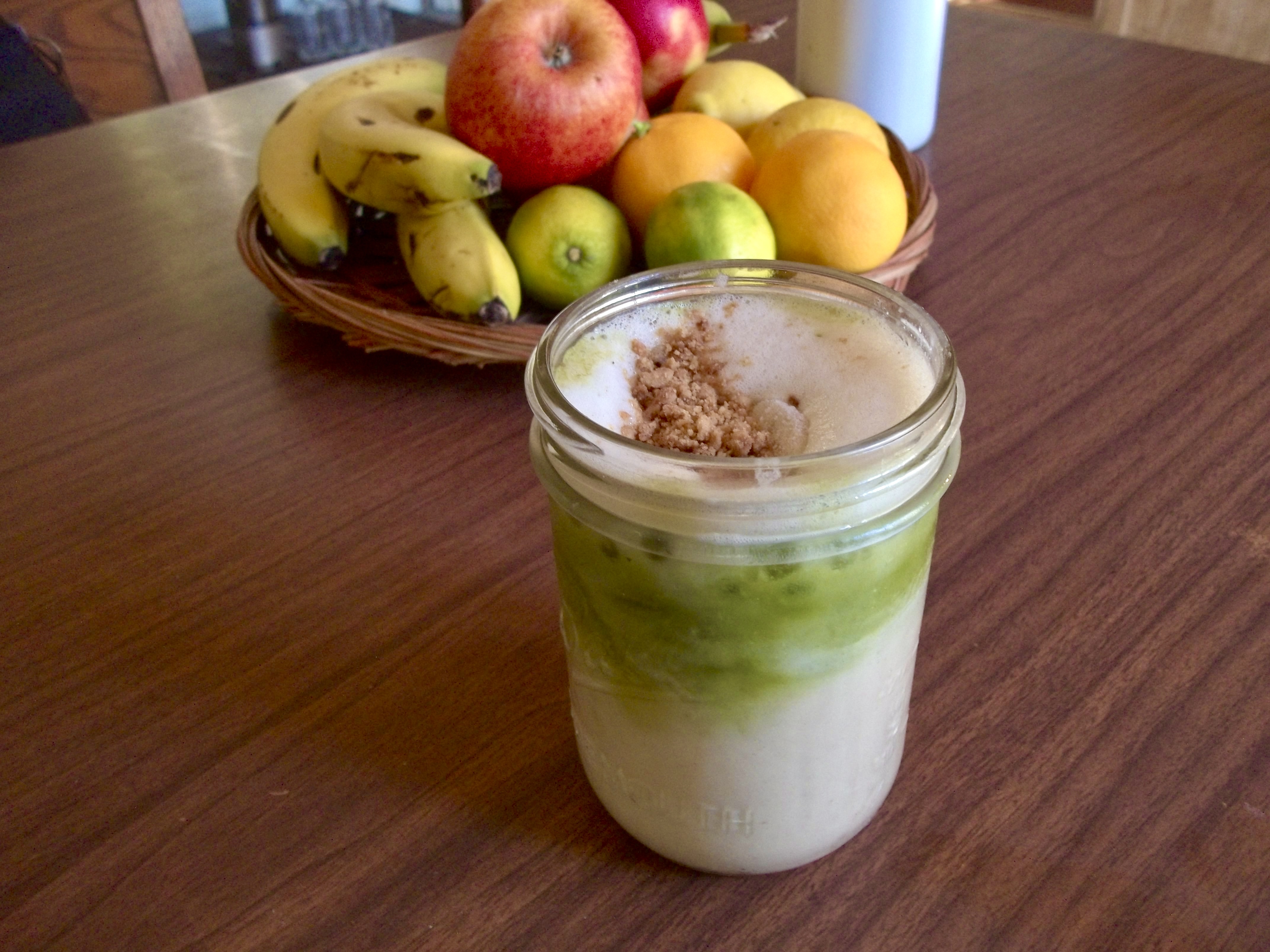banana bread matcha latte on a table with other fruits