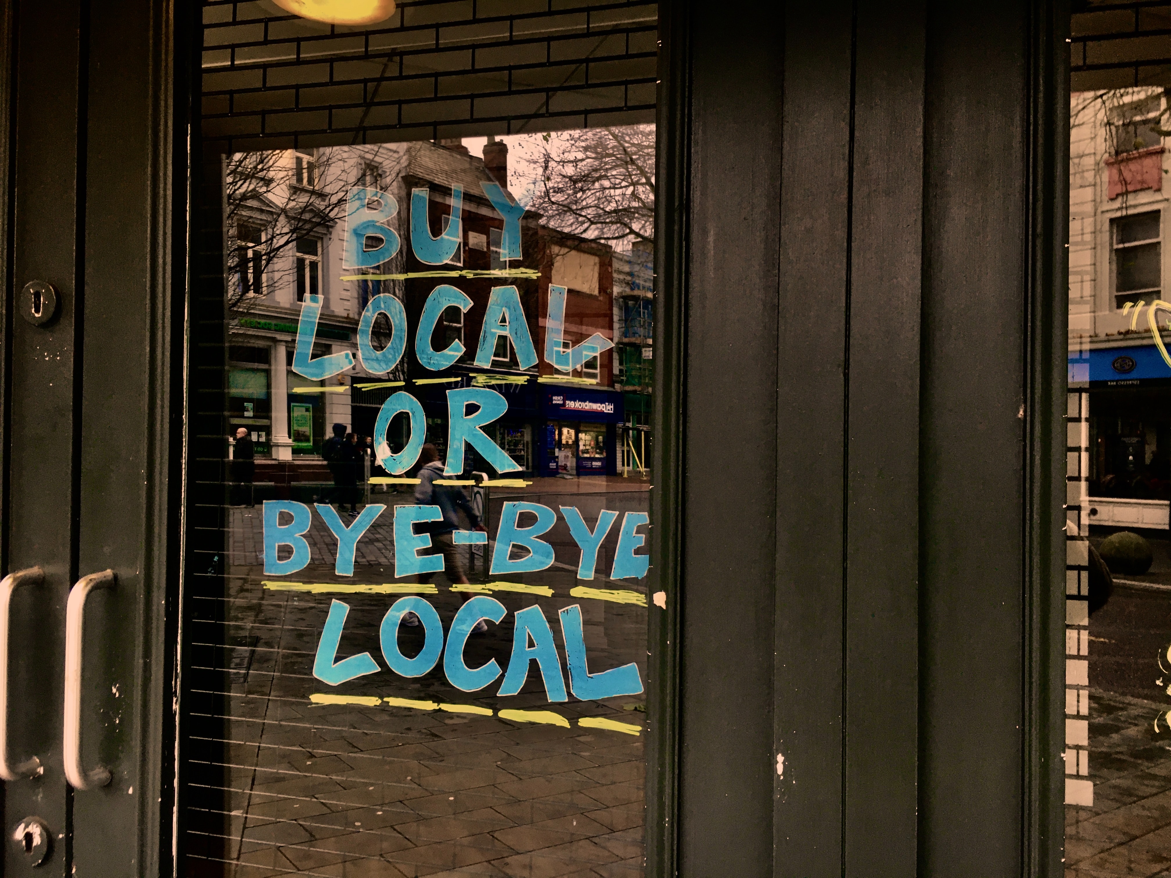 blue and white signage on door