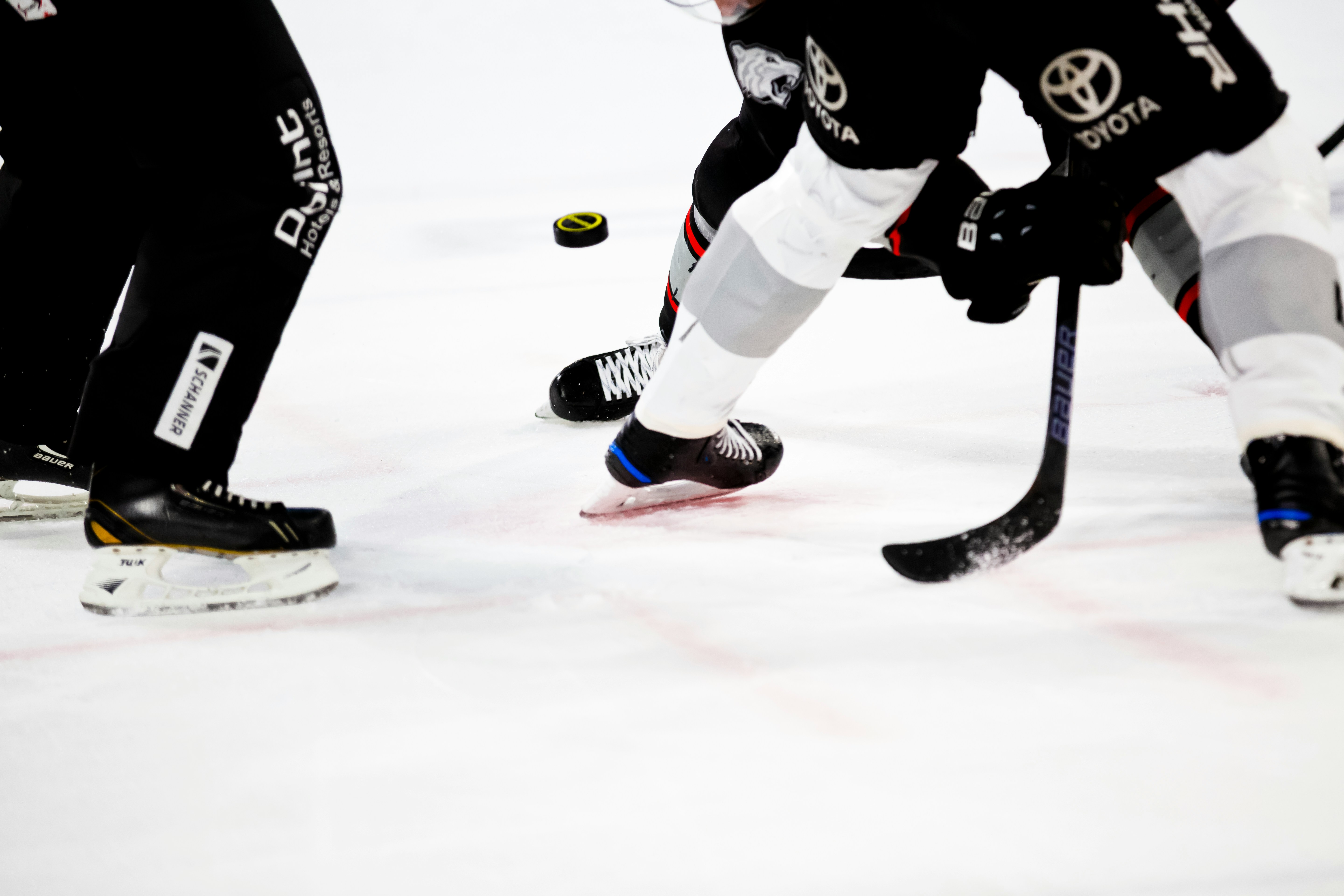 detail shot of hockey players on ice
