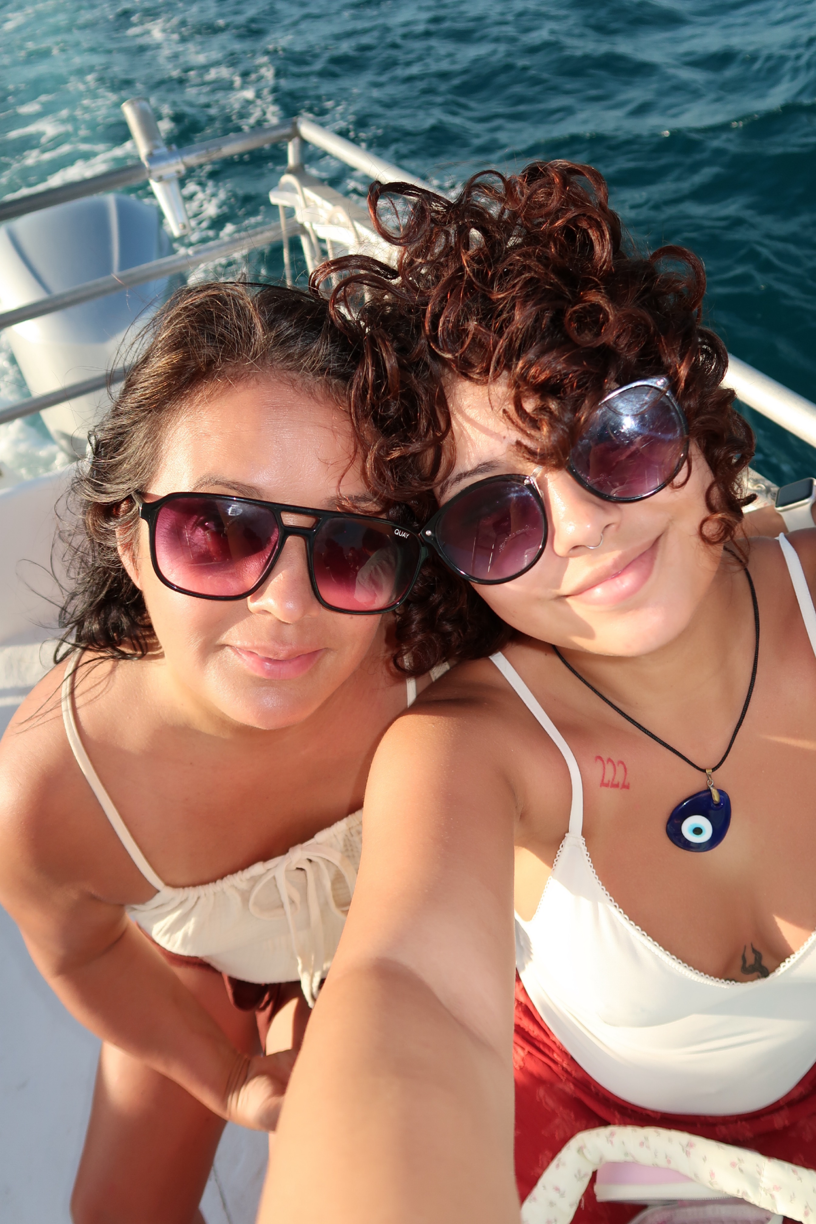 Mother and daughter smiling with sunglasses