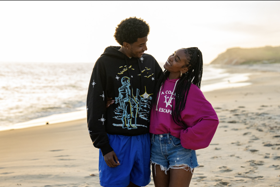 couple looking at eachother on beach