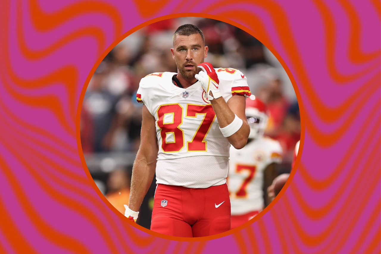 Travis Kelce walking on the field.