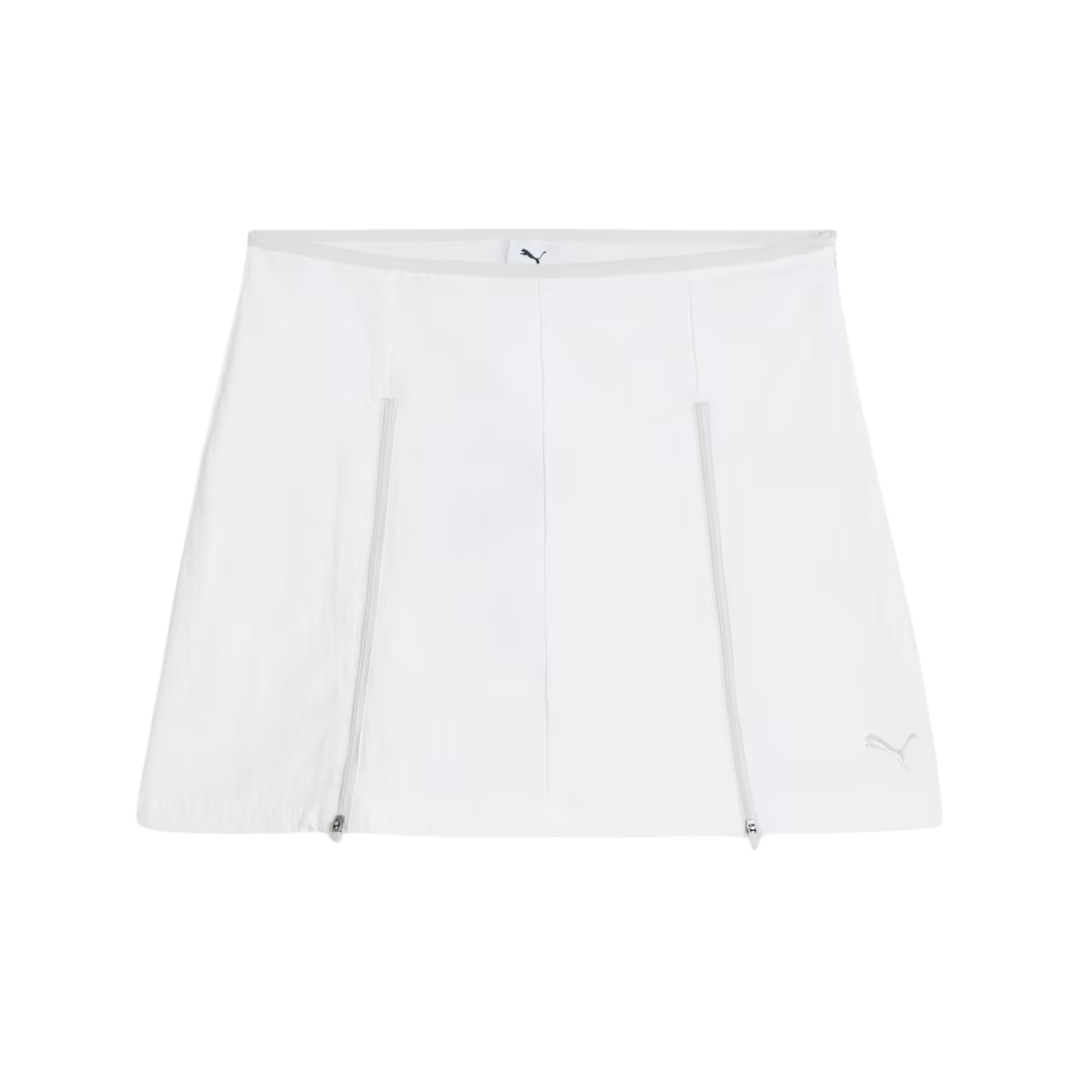 White athletic skirt with a simple design. Two vertical seams run down the front. The Puma logo is subtly placed at the bottom right.