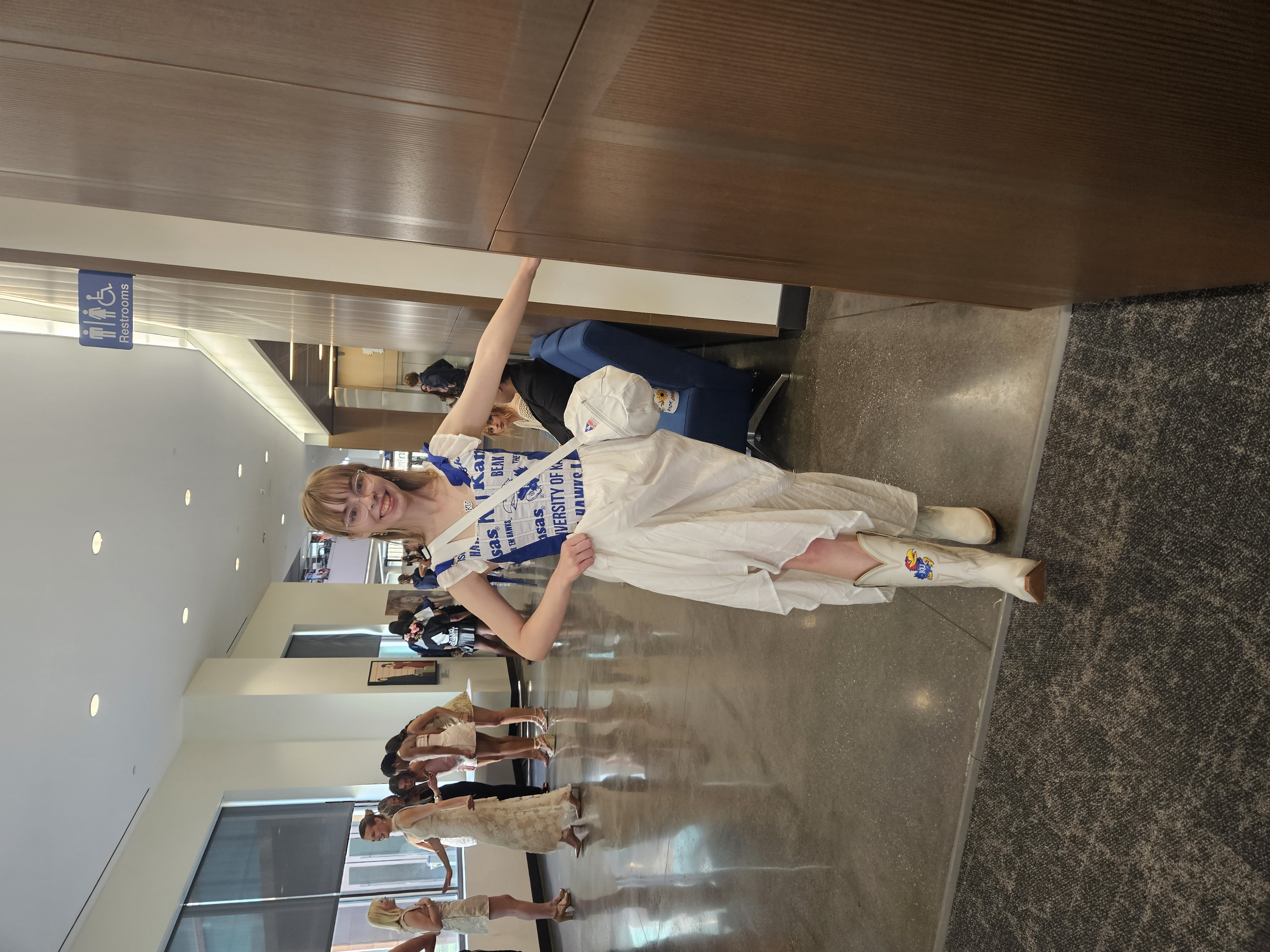 A student shows off her outfit.