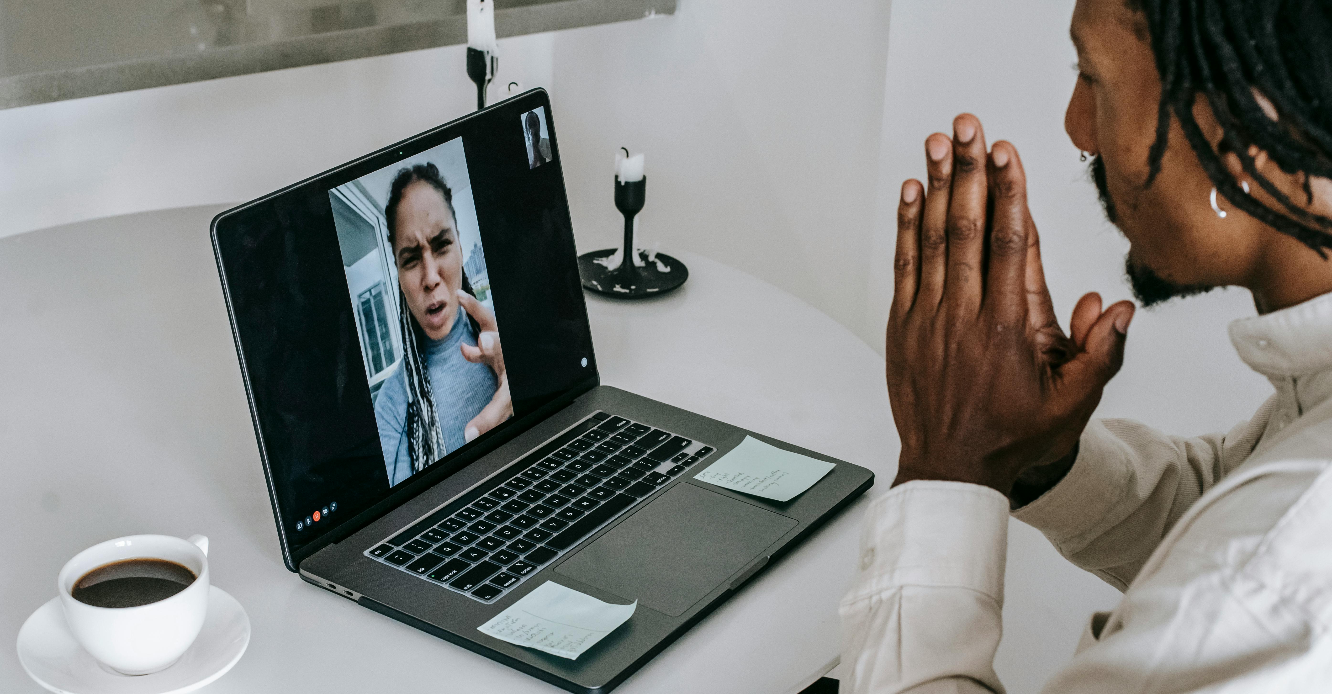 Irritated black couple having argument via video call