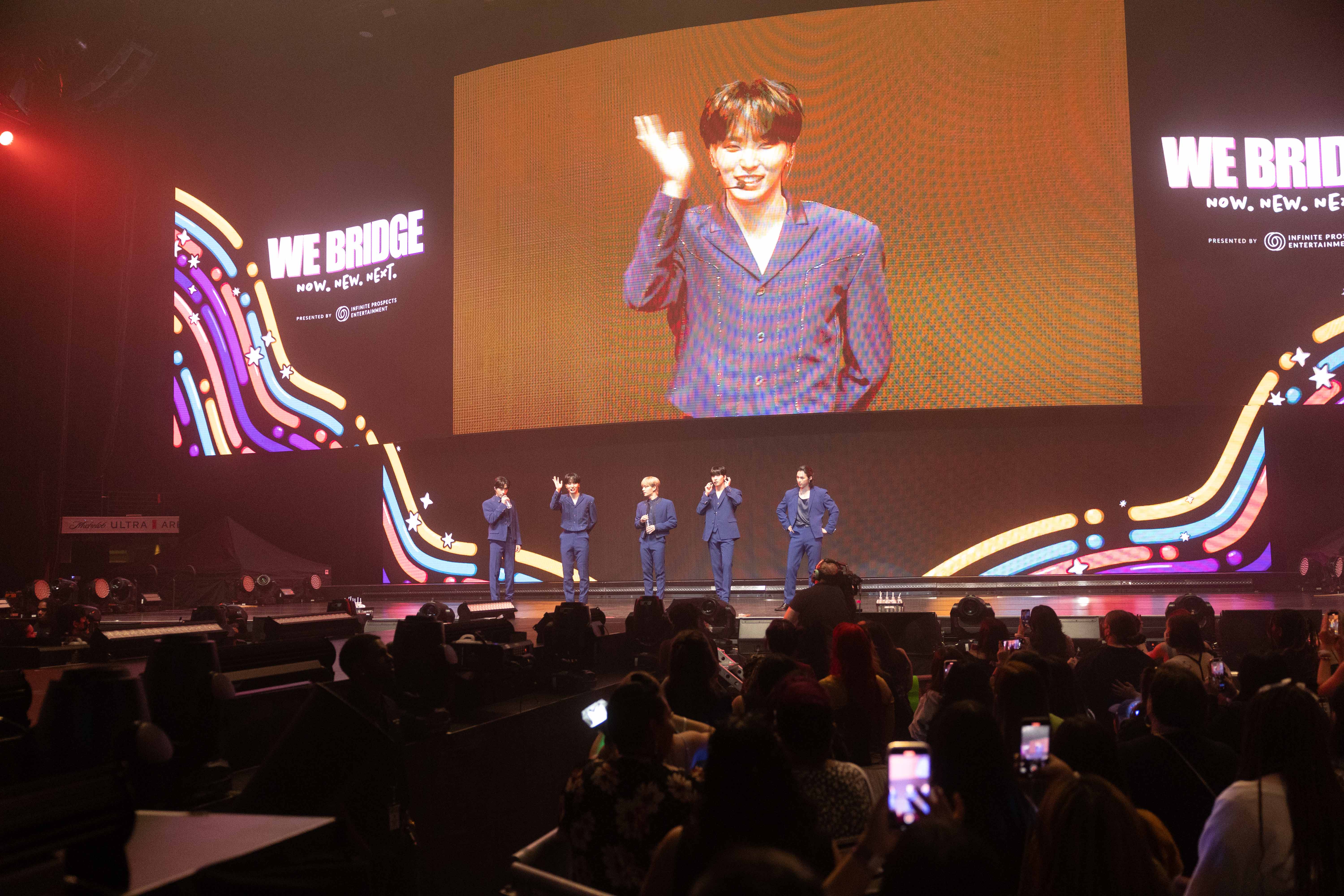 k-pop group performing on stage